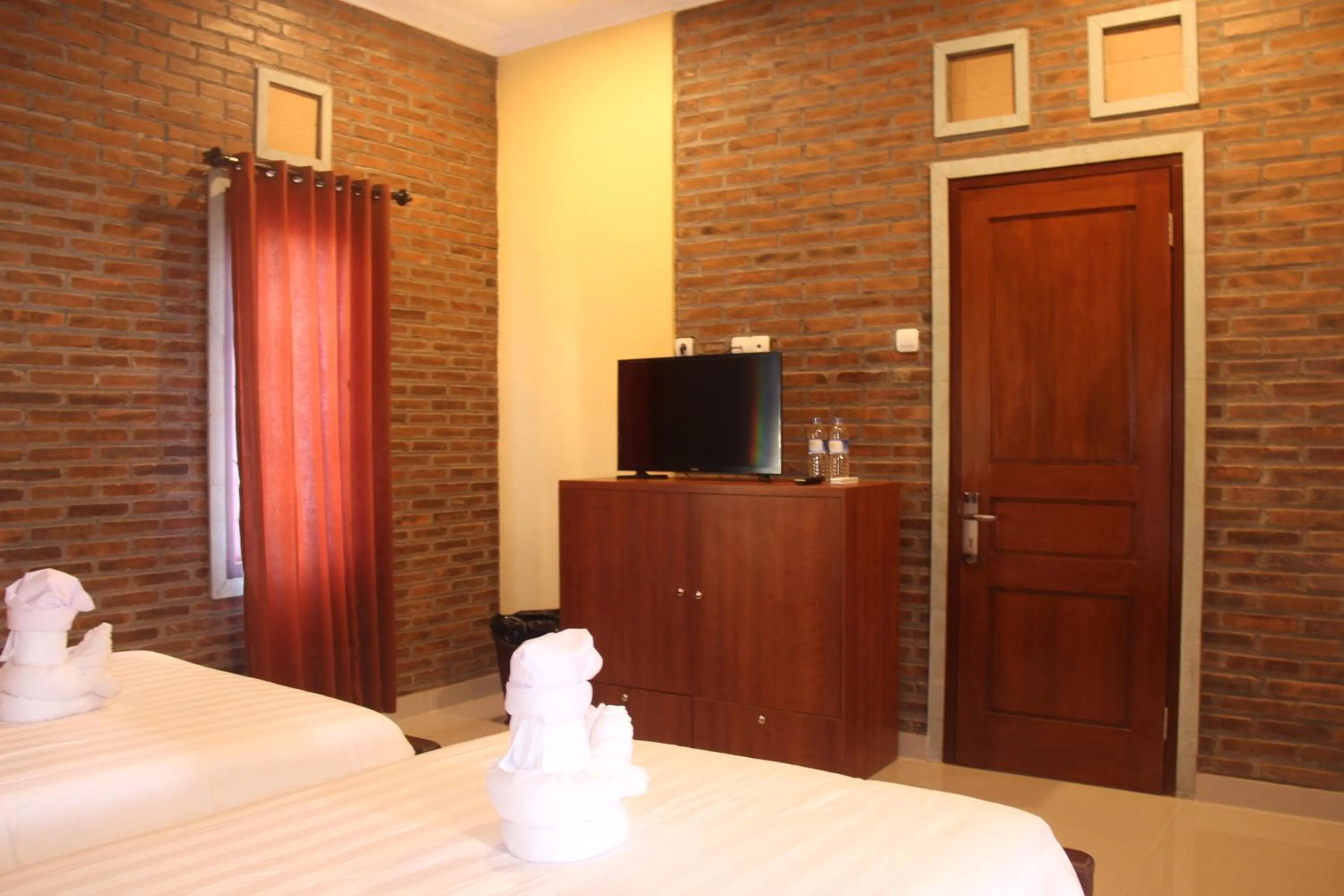 TV and multimedia, Bed in The Garuda Homestay Sanur