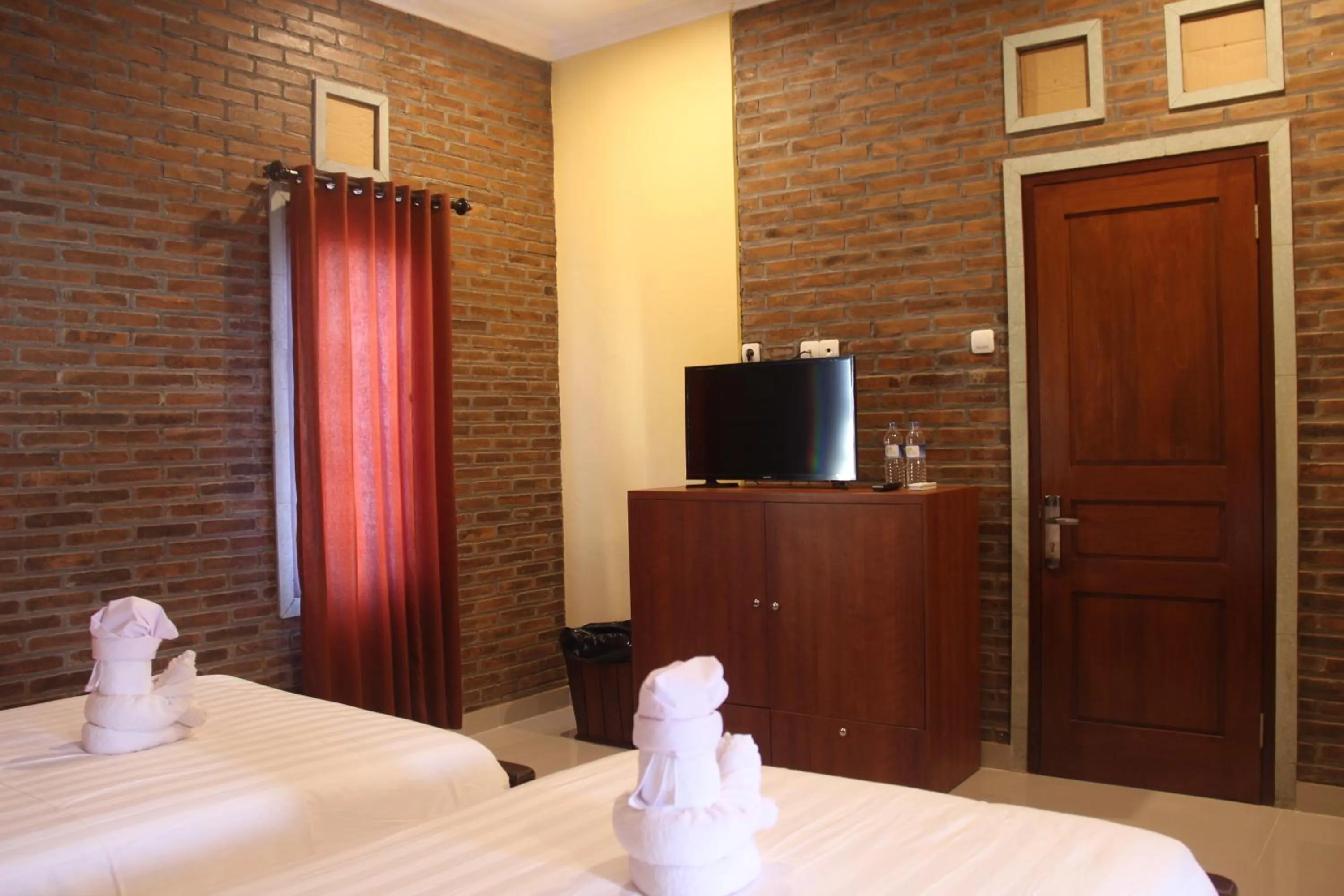 TV and multimedia, Bed in The Garuda Homestay Sanur