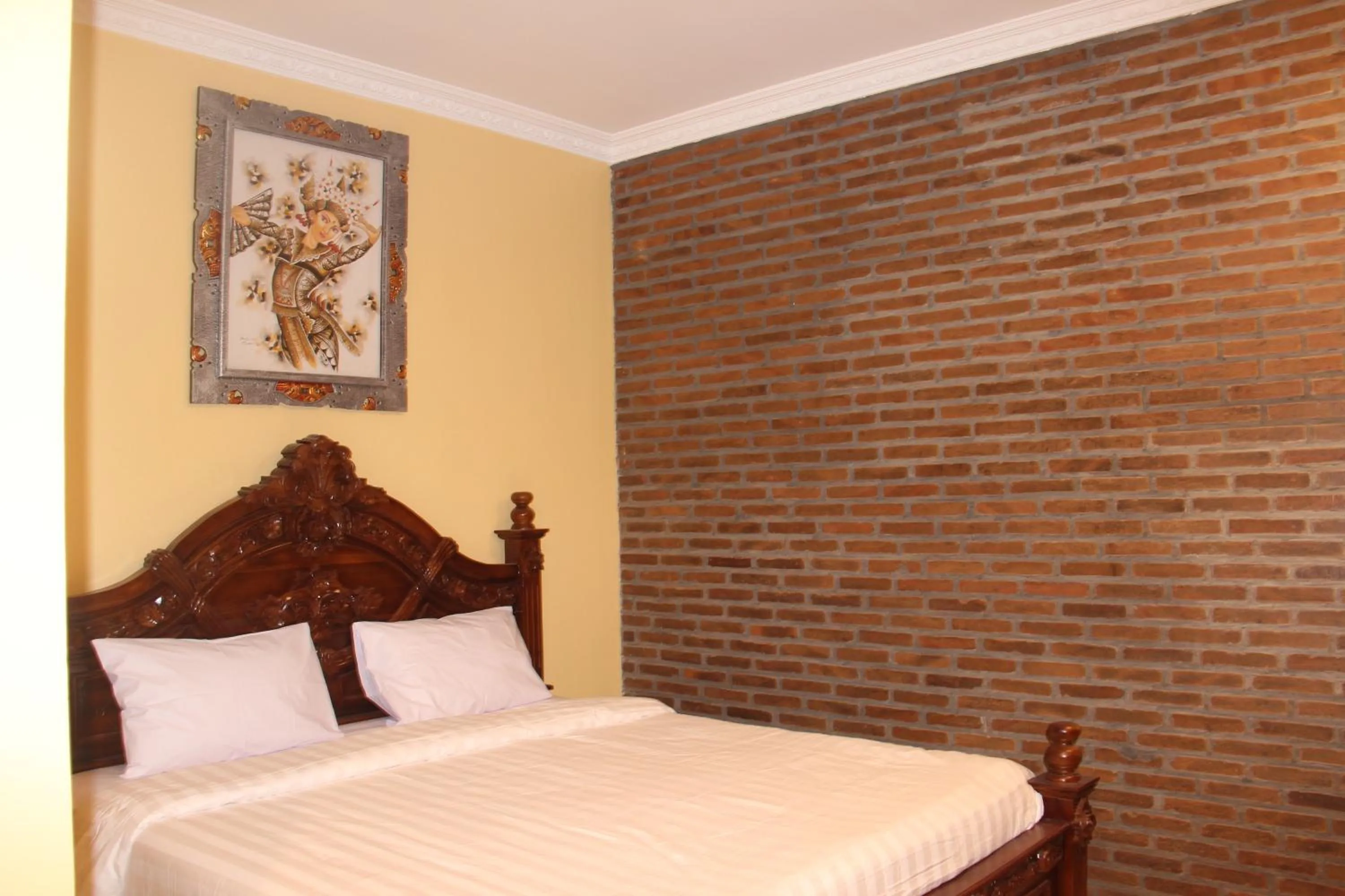 Bed in The Garuda Homestay Sanur