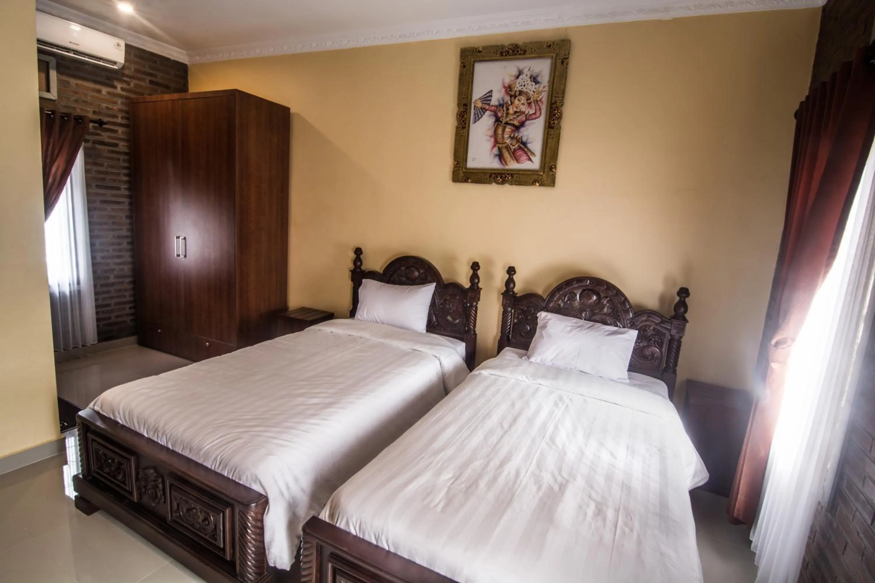 Bed in The Garuda Homestay Sanur