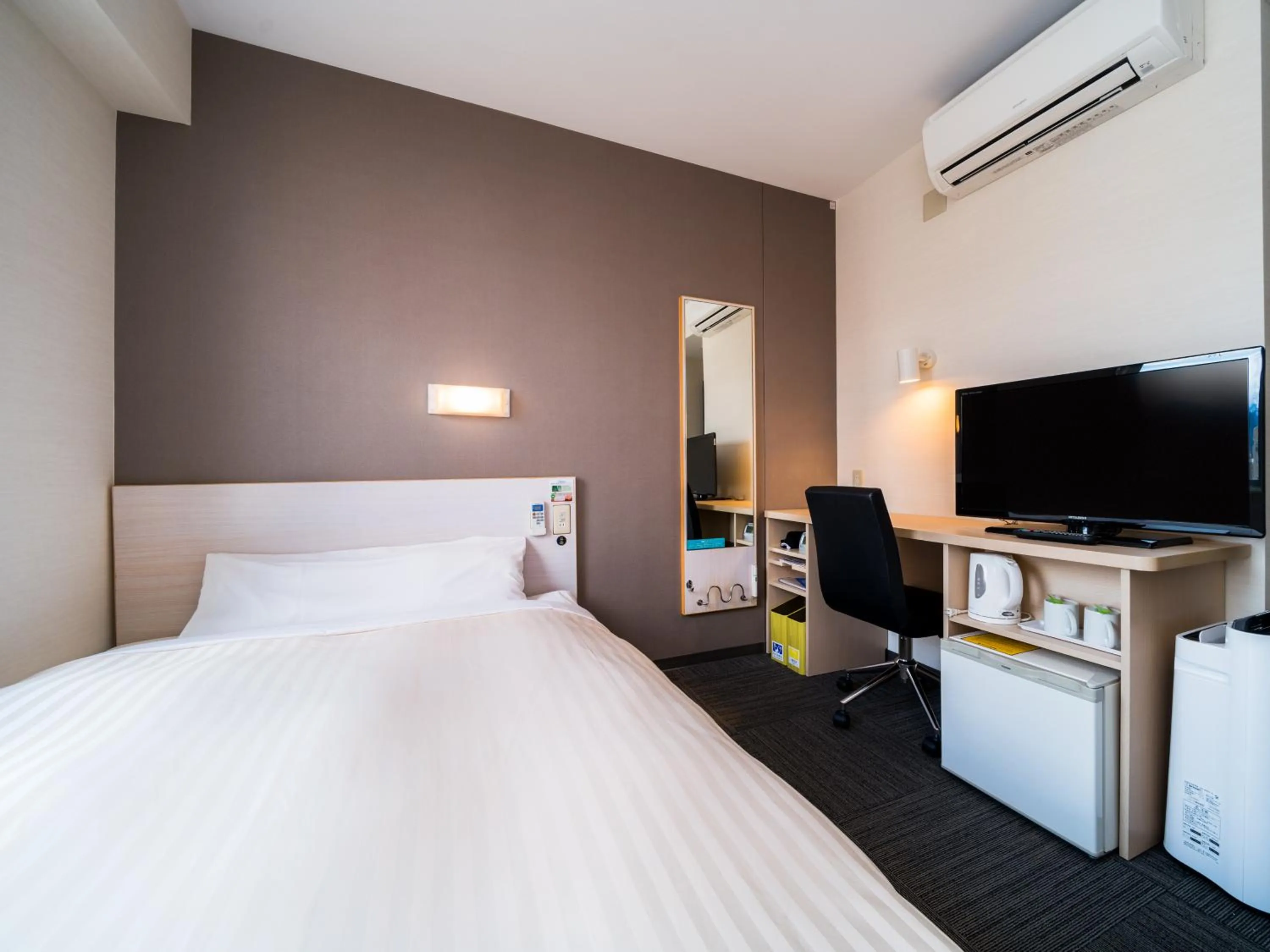 Bed in Super Hotel Yamagataeki Nishiguchi Hot Spring