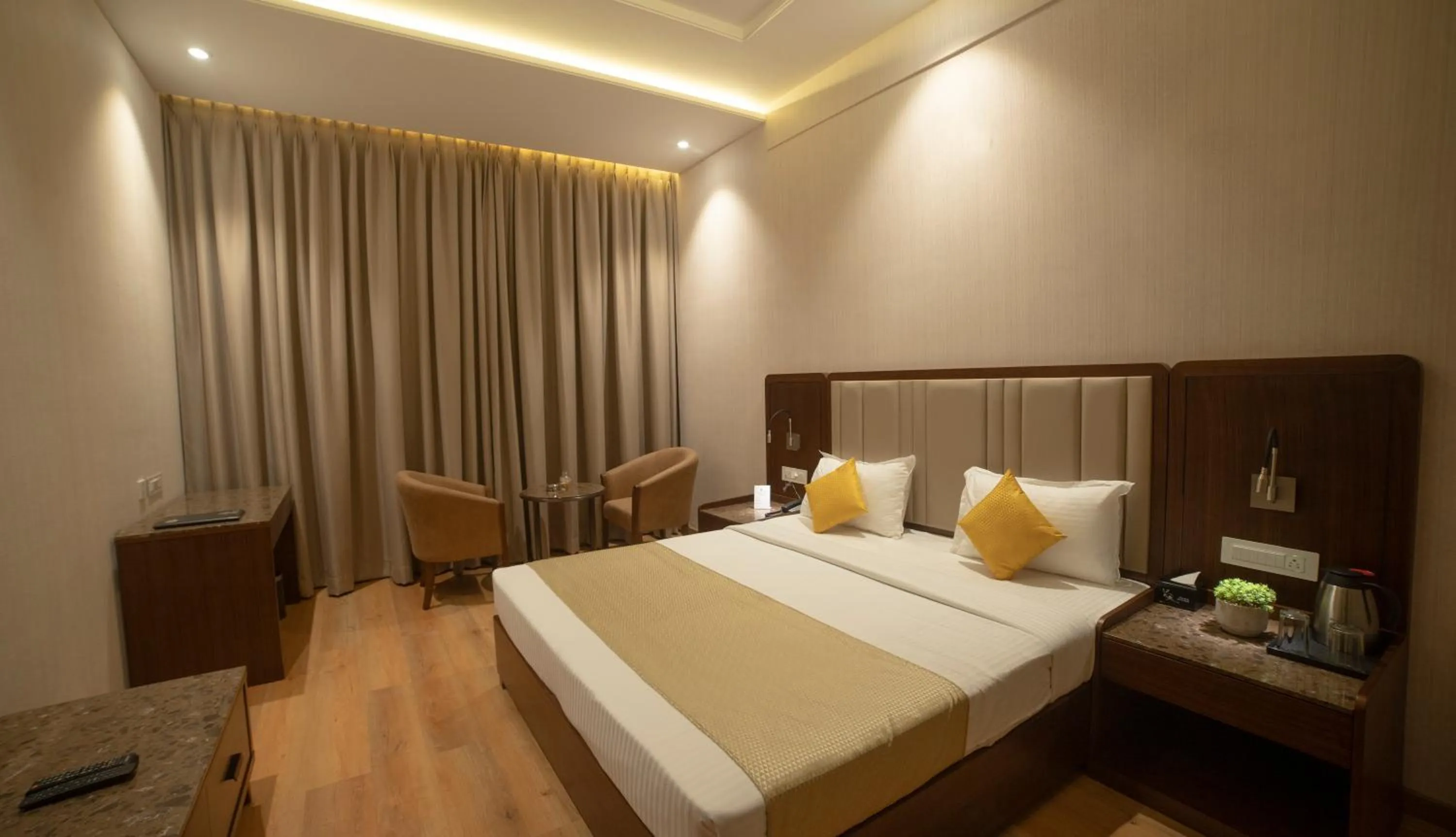 Photo of the whole room, Bed in HOTEL RAJHANS ABHINANDAN