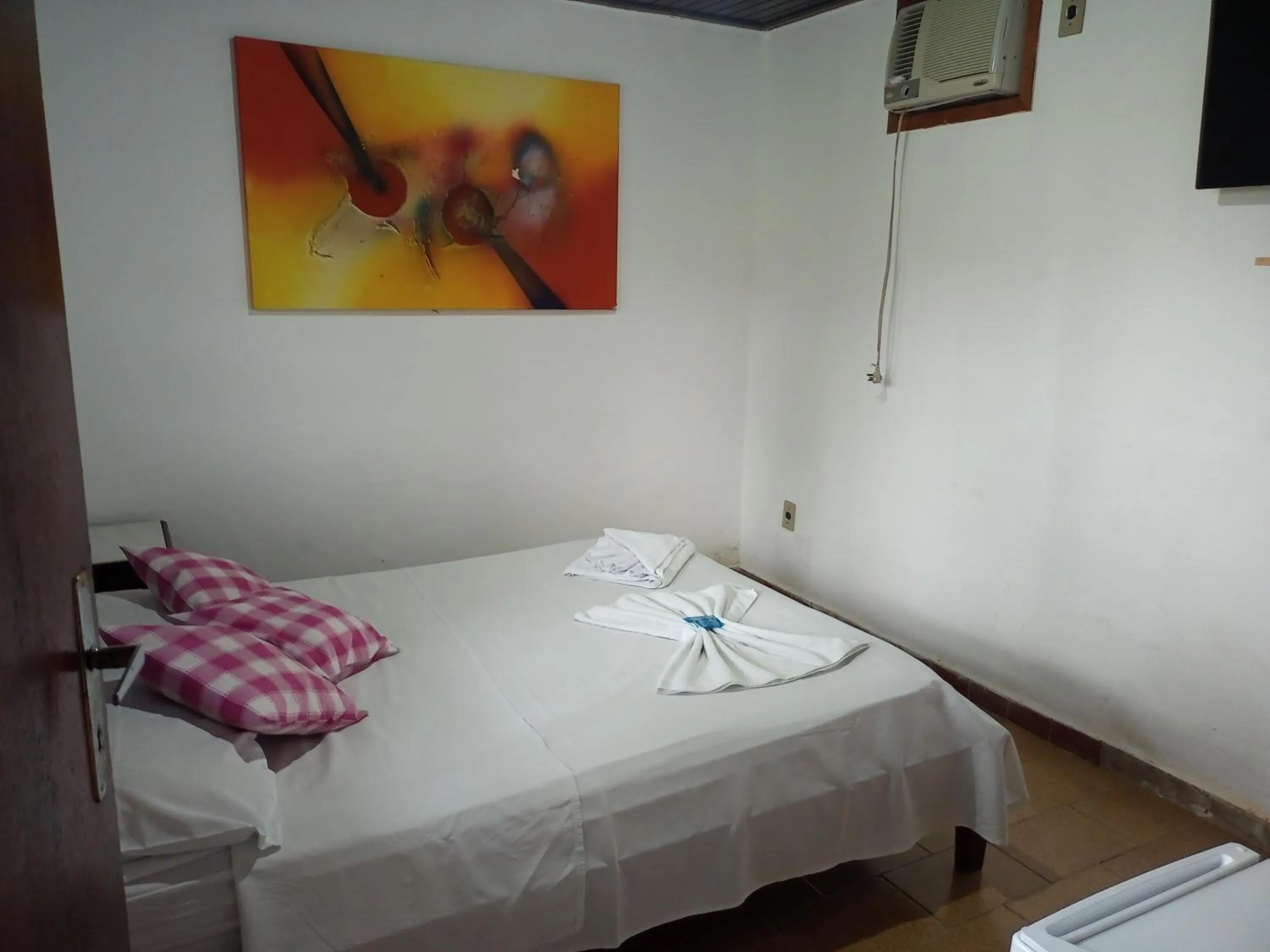 Bed in Pousada Nova Conquista