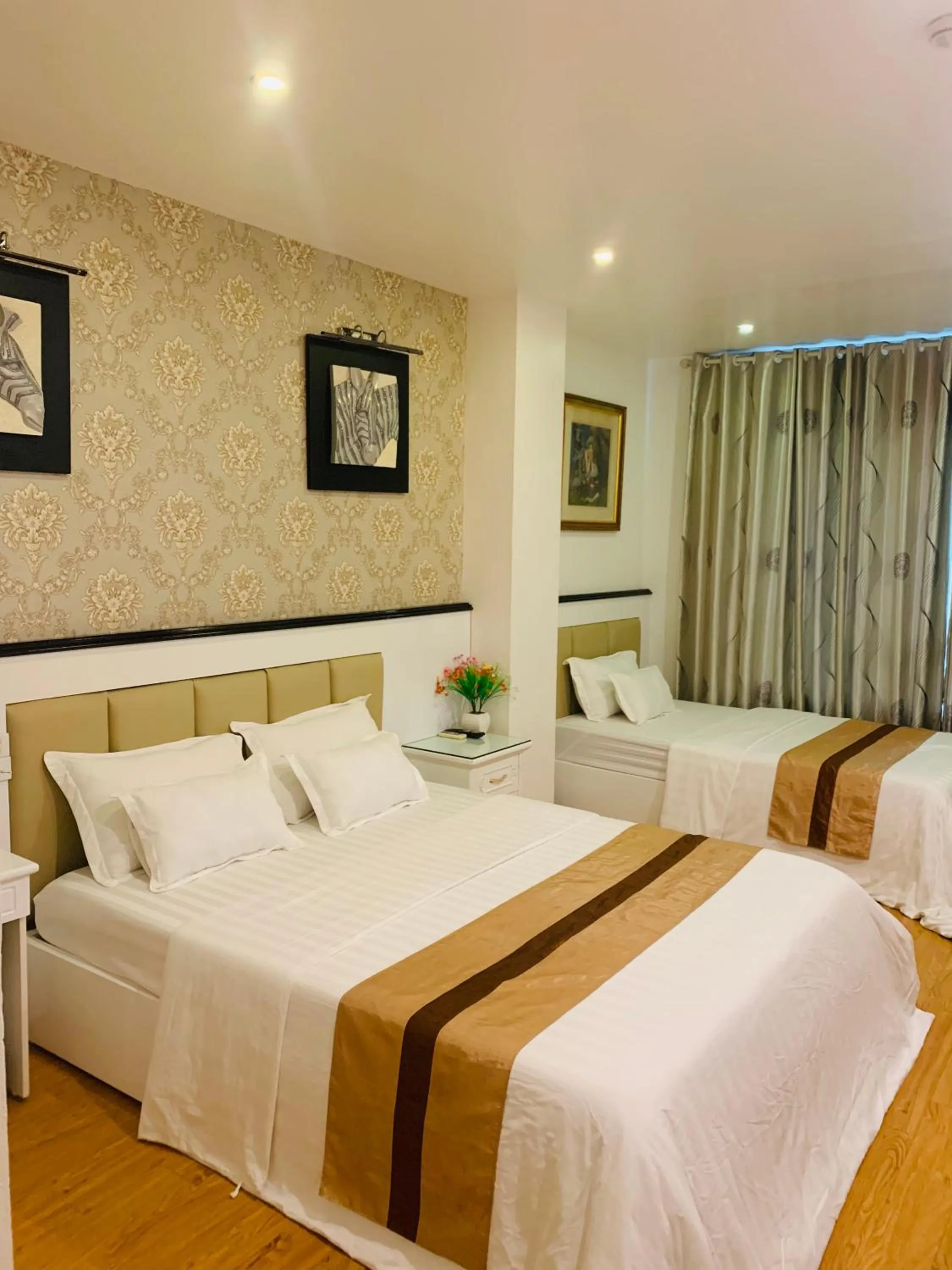 Photo of the whole room, Bed in Hotel Nhất Ly