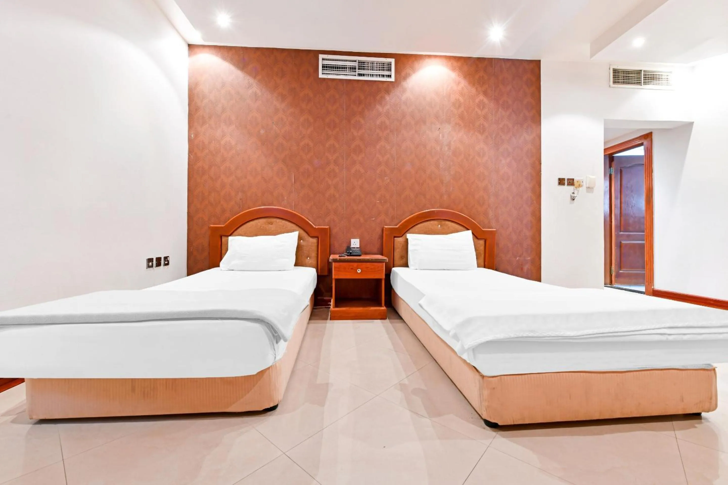 Bedroom, Bed in OYO 118 Revira Hotel