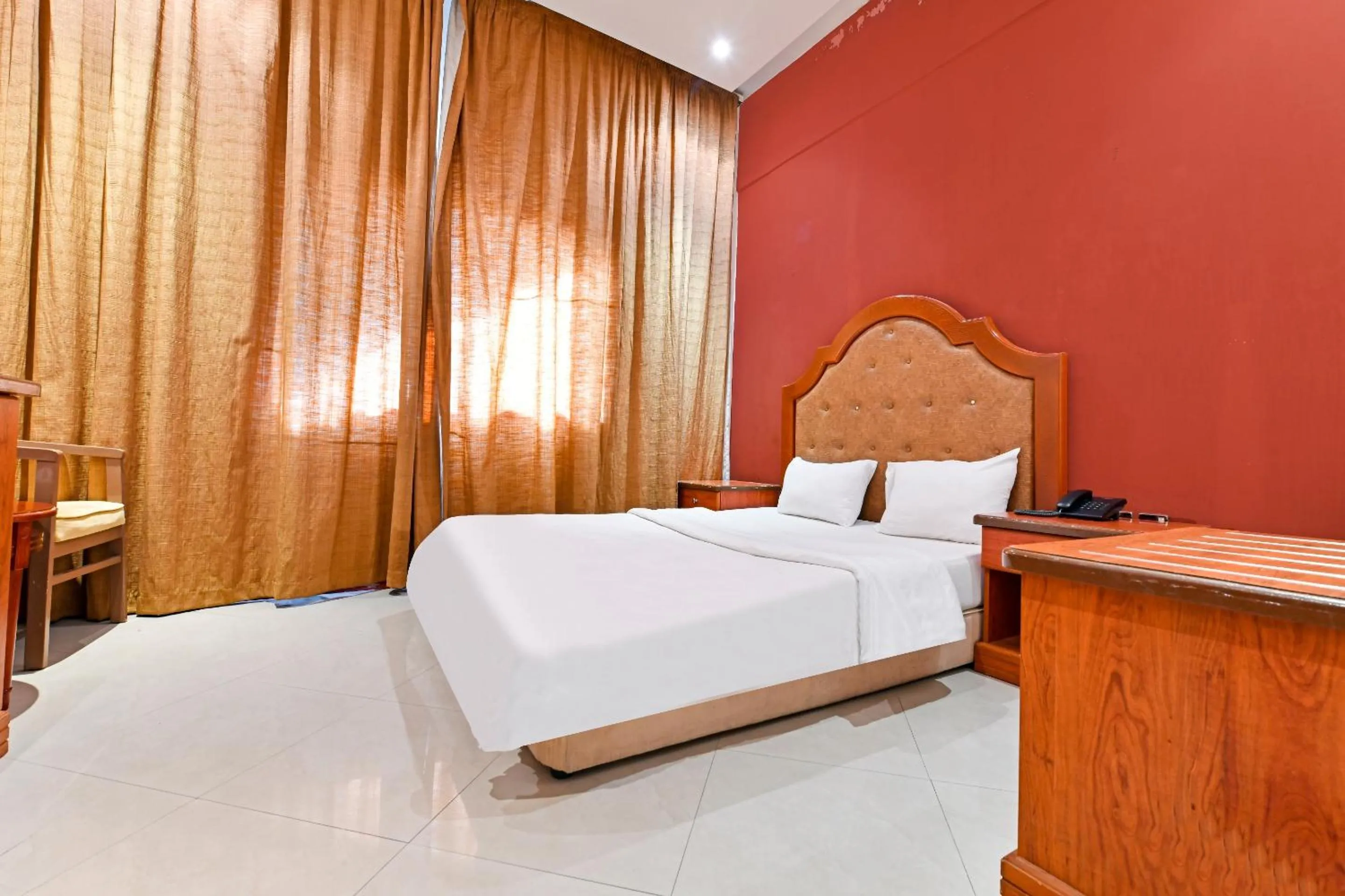 Bedroom, Bed in OYO 118 Revira Hotel