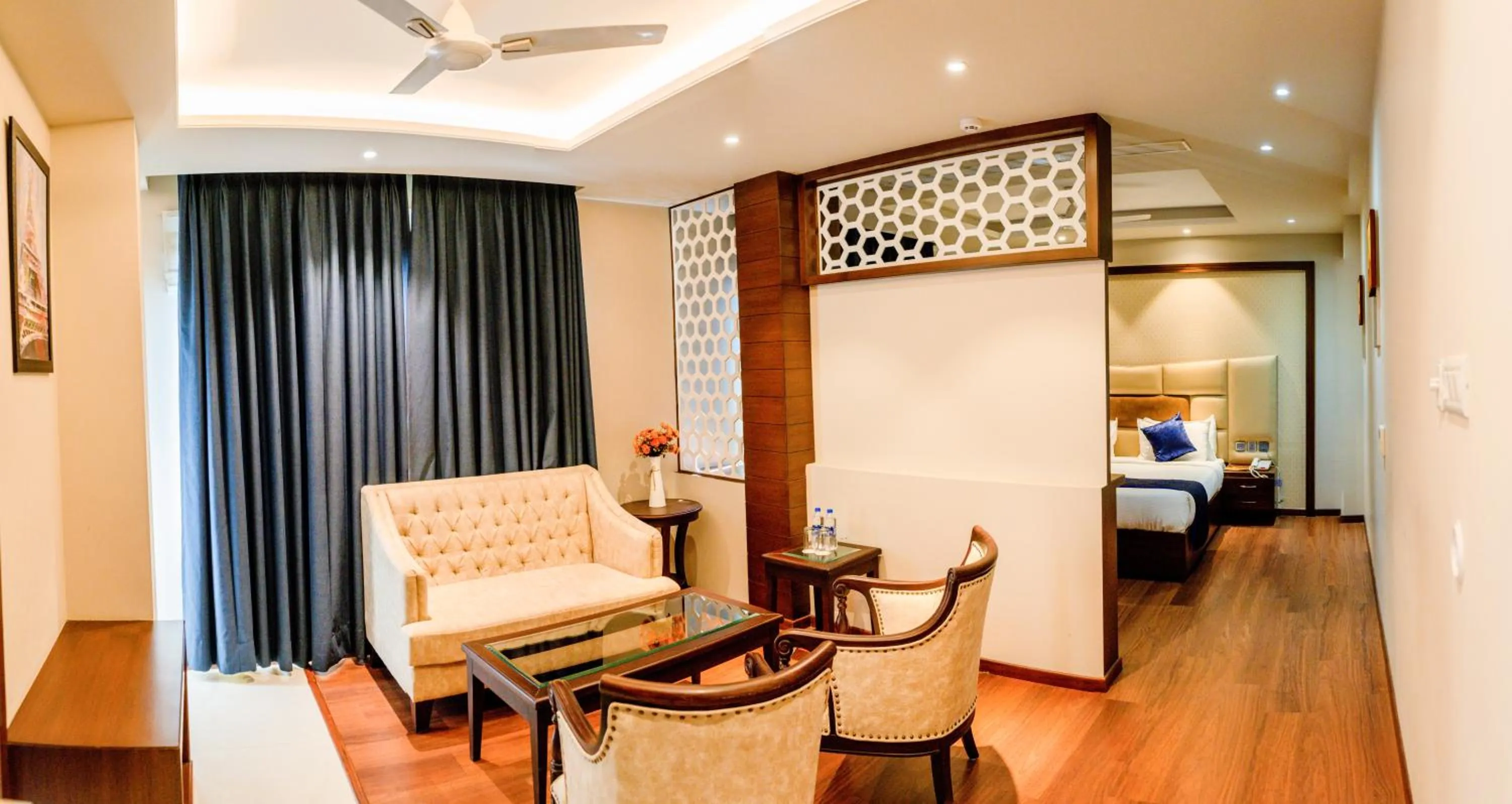 Seating area, Bed in juSTa Palampur Resort & Convention Centre