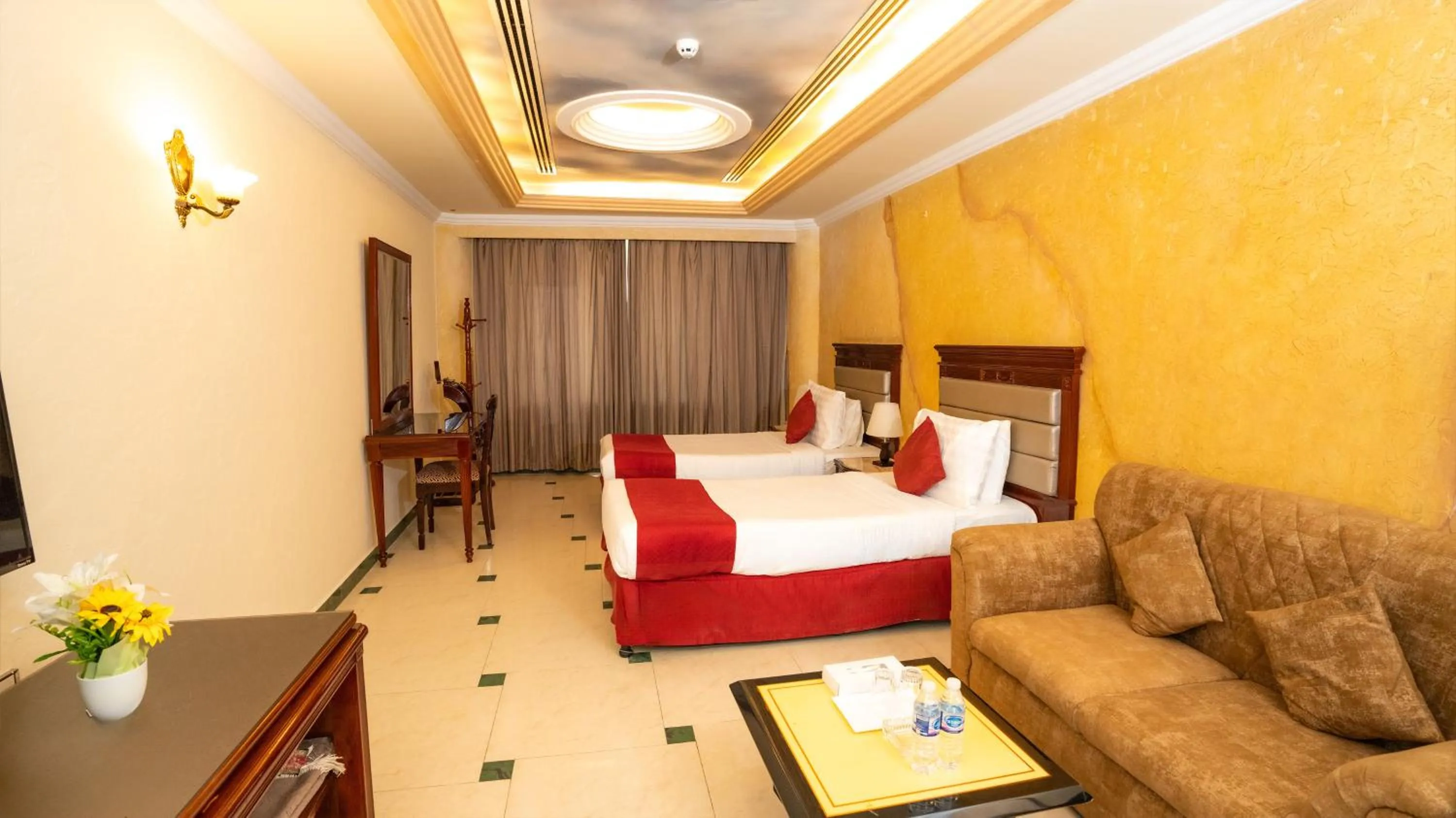 Seating area, Bed in Oriental Hotel Apartments