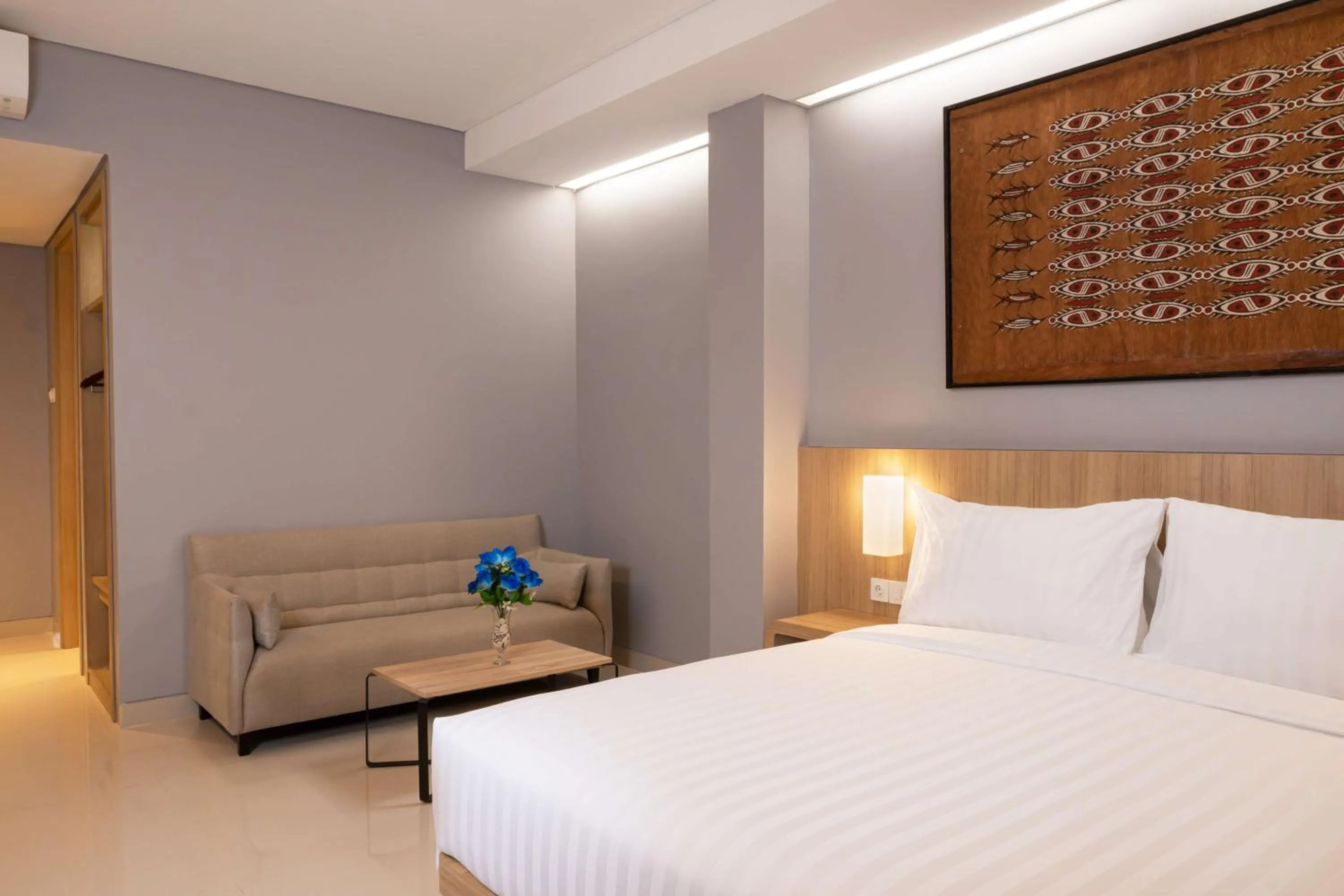 Living room, Bed in BATIQA Hotel Jayapura