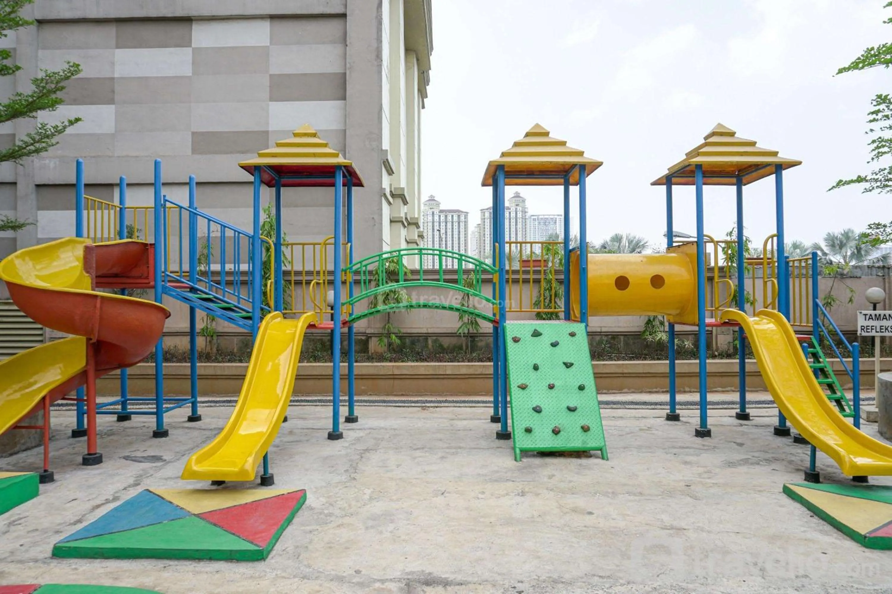 Children play ground in Spacious 3BR Residence at Grand Palace Kemayoran Apartment By Travelio