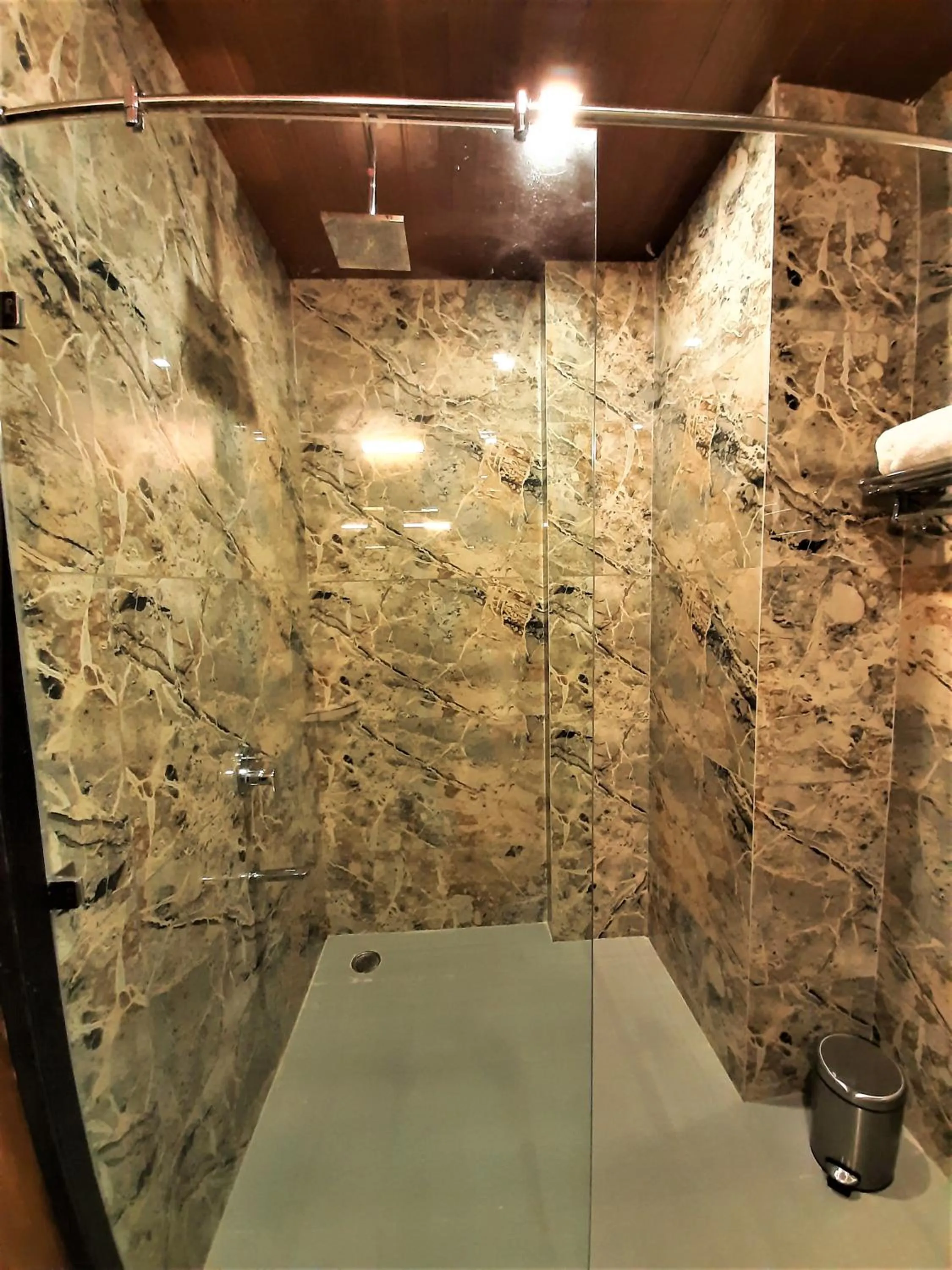Shower in Suvin Residency with Rooftop Swimming Pool