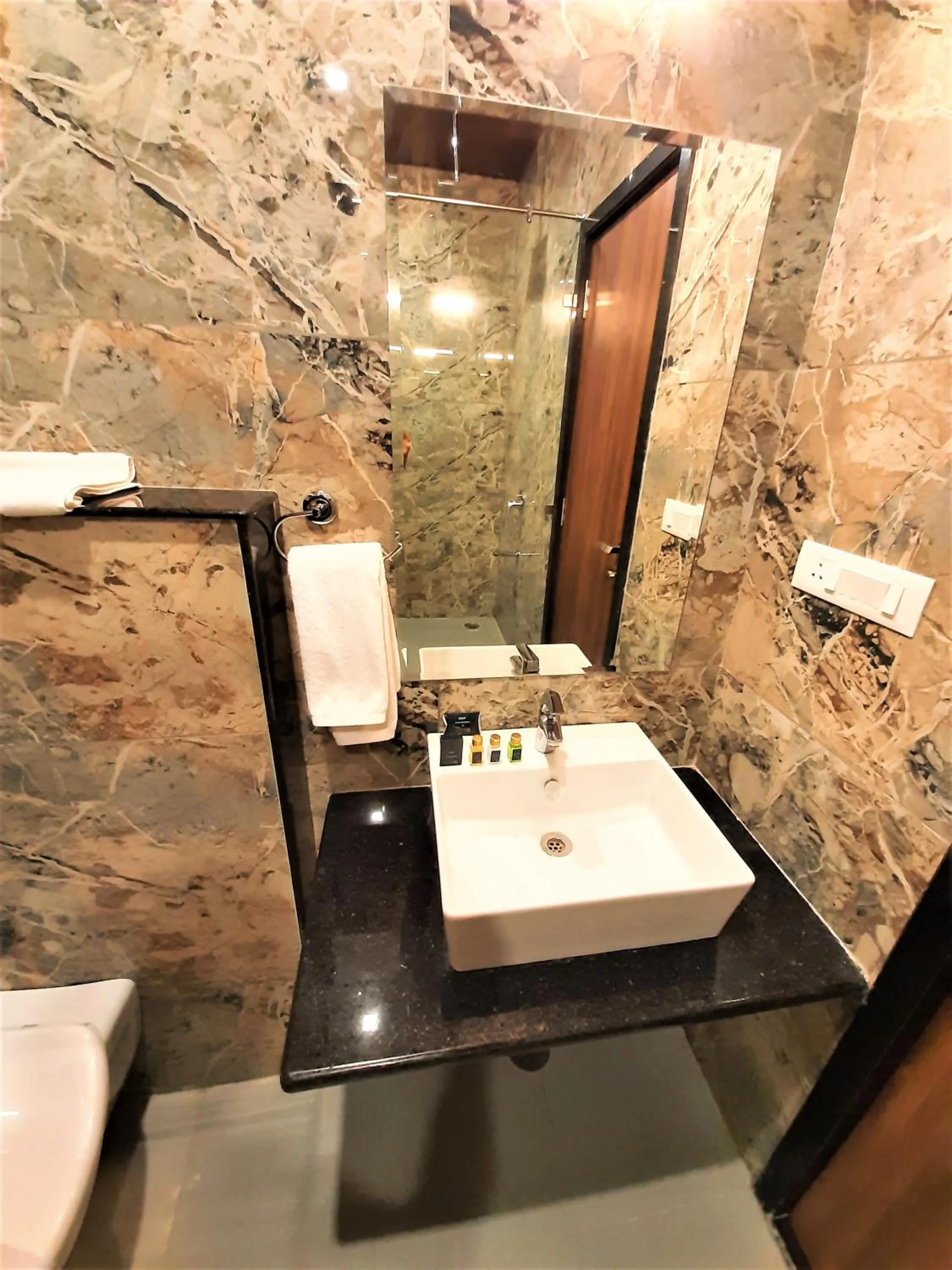 Toilet in Suvin Residency with Rooftop Swimming Pool