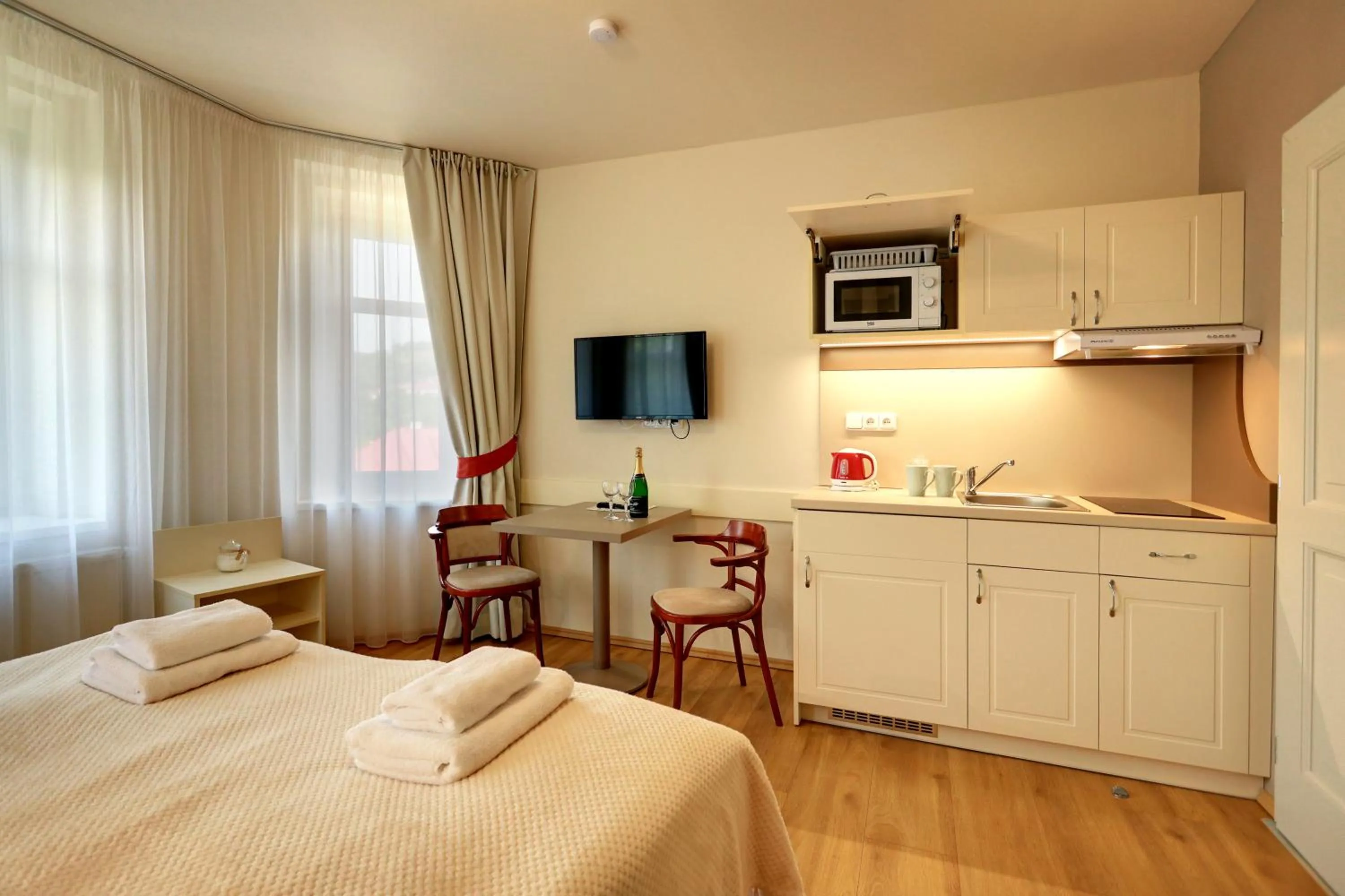 Kitchen or kitchenette, Bed in APARTMÁNY ADAM