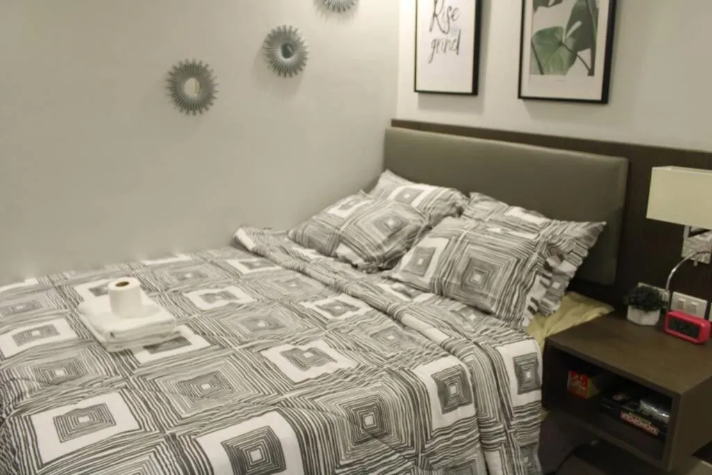 Bed in A2J Luxury BGC Balcony Suite Near SM AURA Taguig