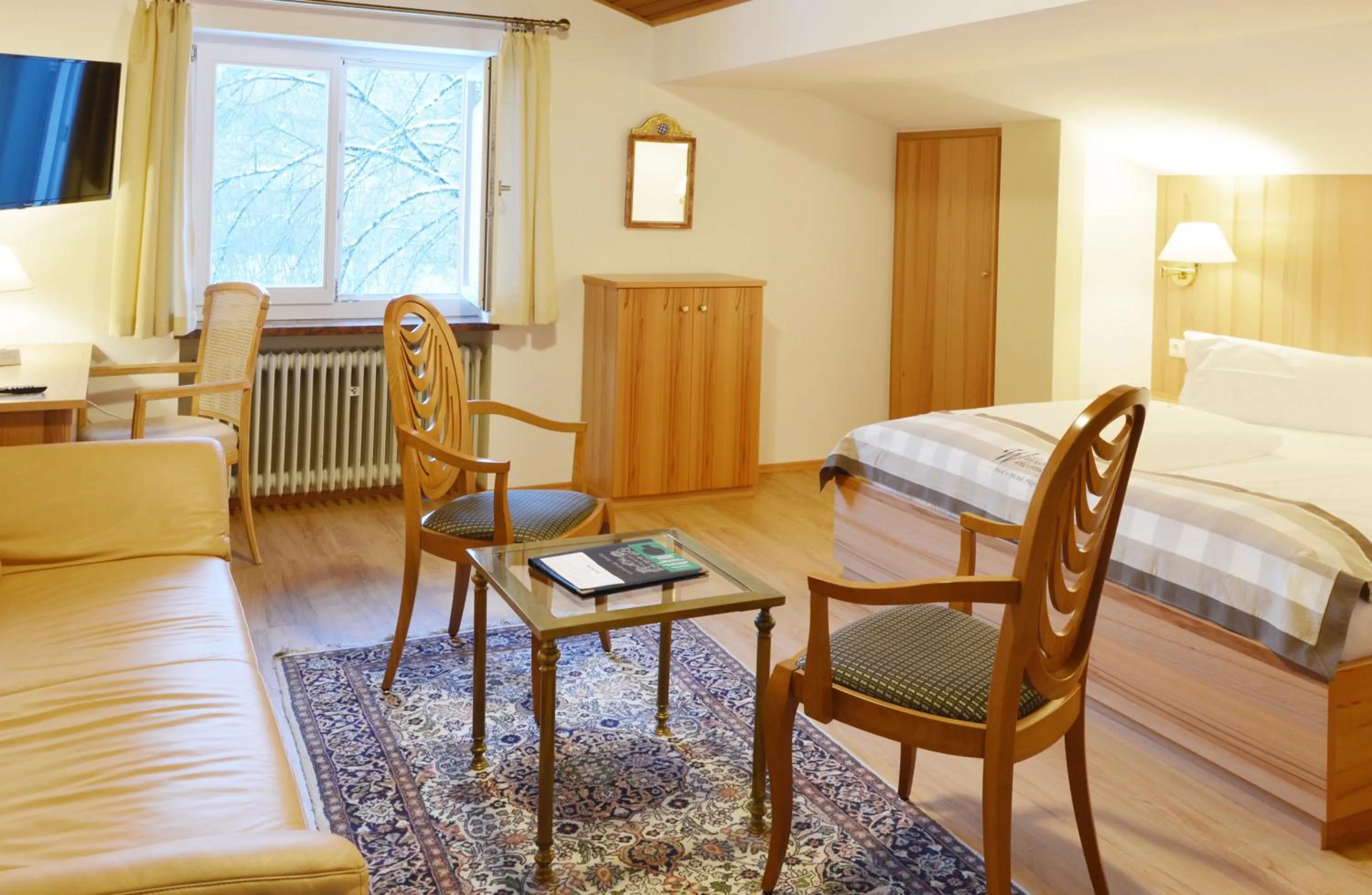 Seating area, Bed in Stoll's Hotel Alpina