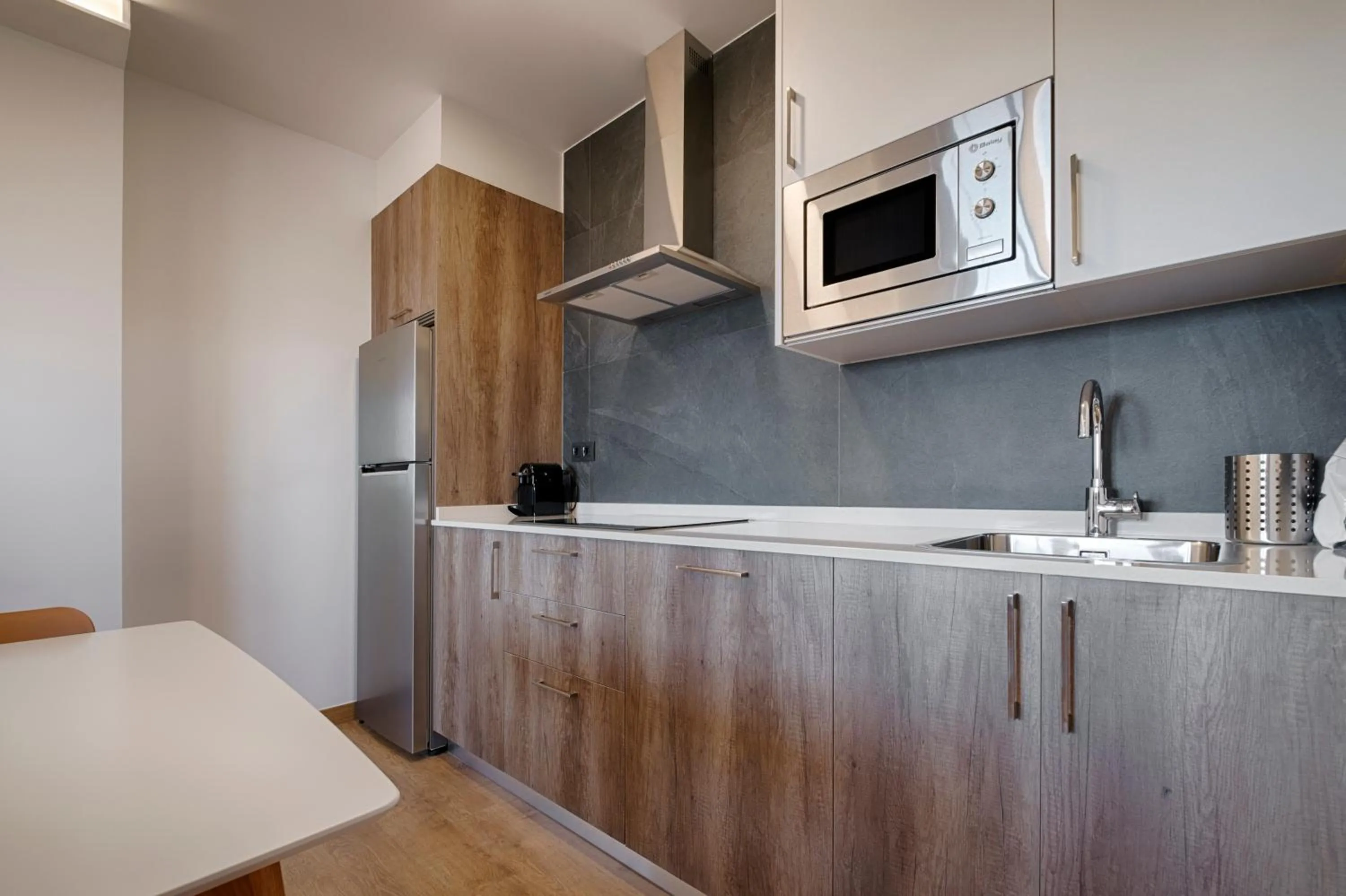 Kitchen or kitchenette in TH Apartments by Como en Casa