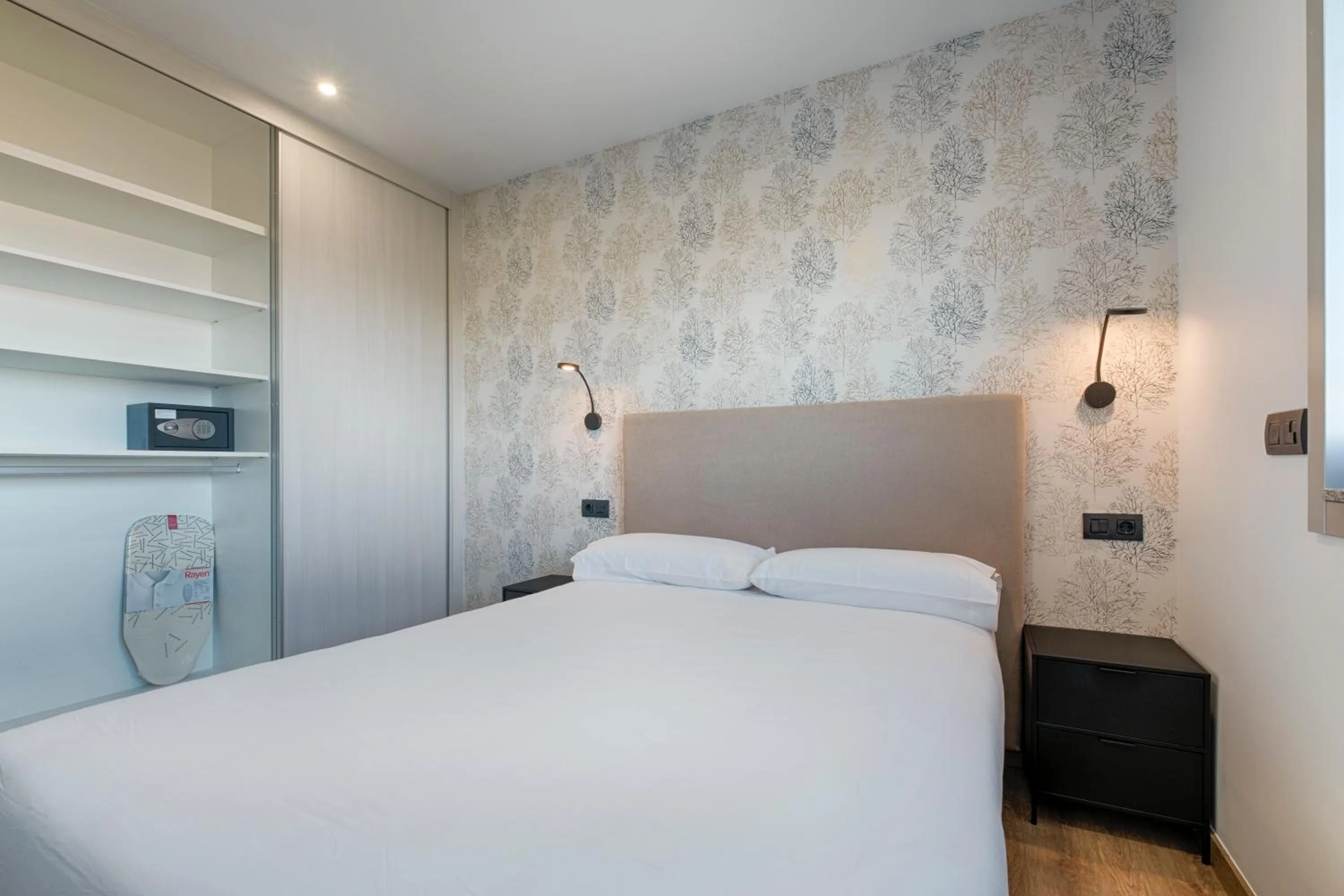 Bed in TH Apartments by Como en Casa