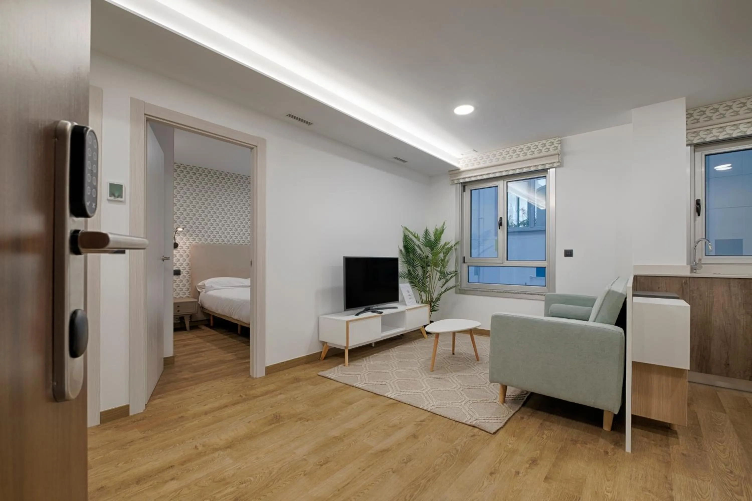 TV and multimedia, Bed in TH Apartments by Como en Casa