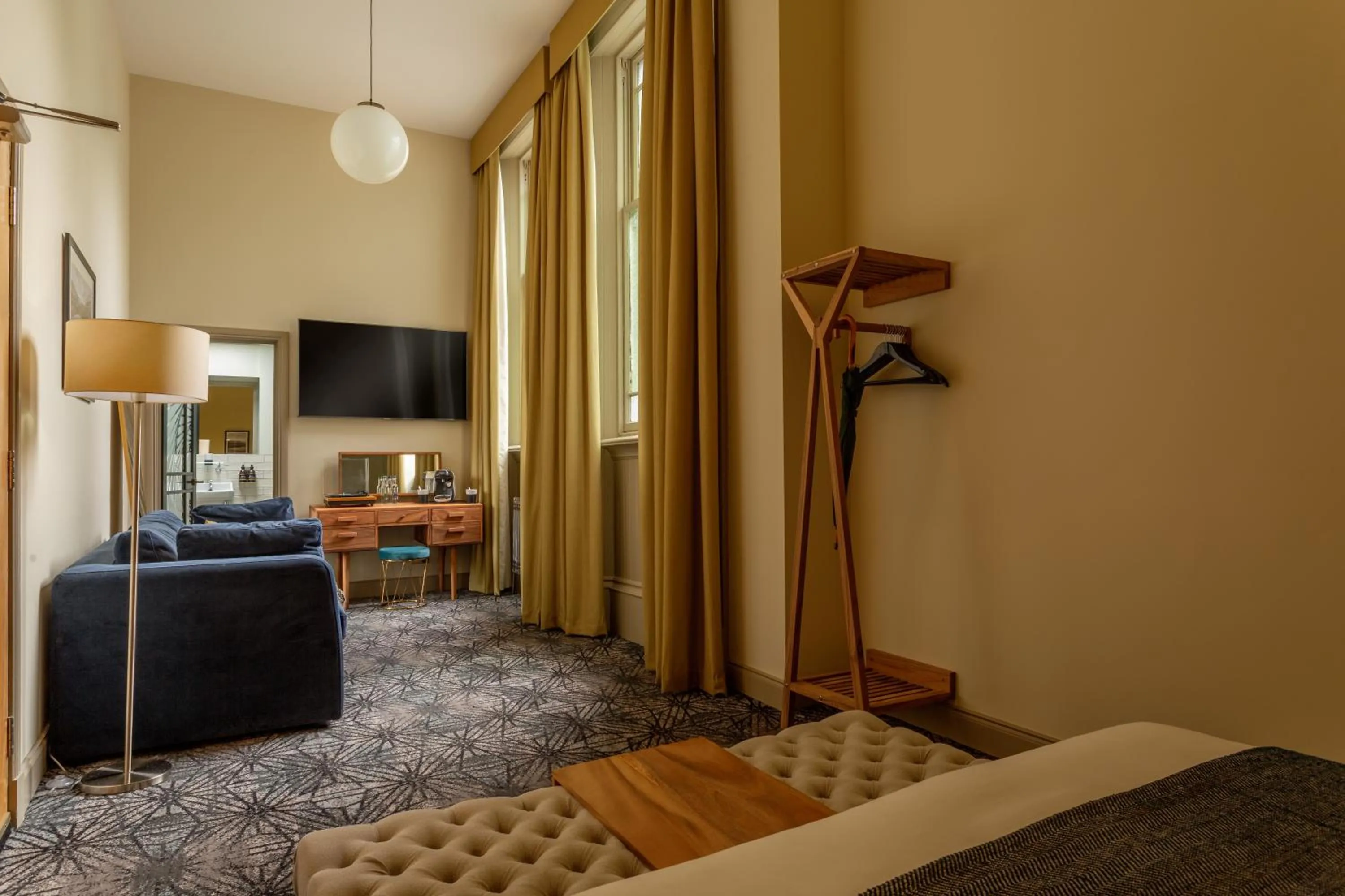 Communal lounge/ TV room, Bed in Riva Boutique Hotel