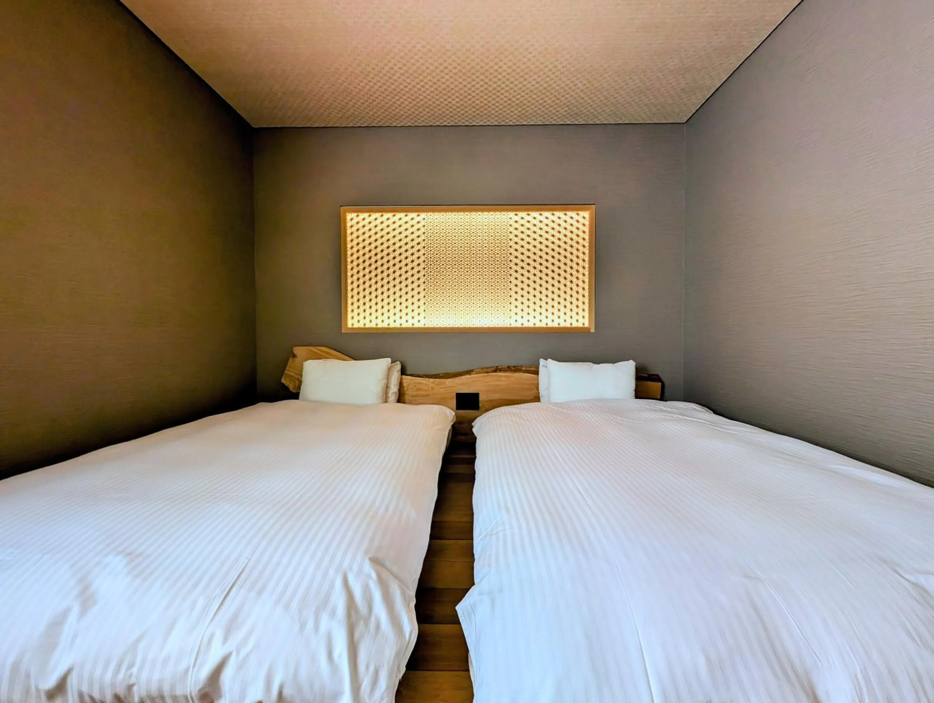 Bed in ひがし茶屋街らしく金沢 Hotel Rashiku kanazawa