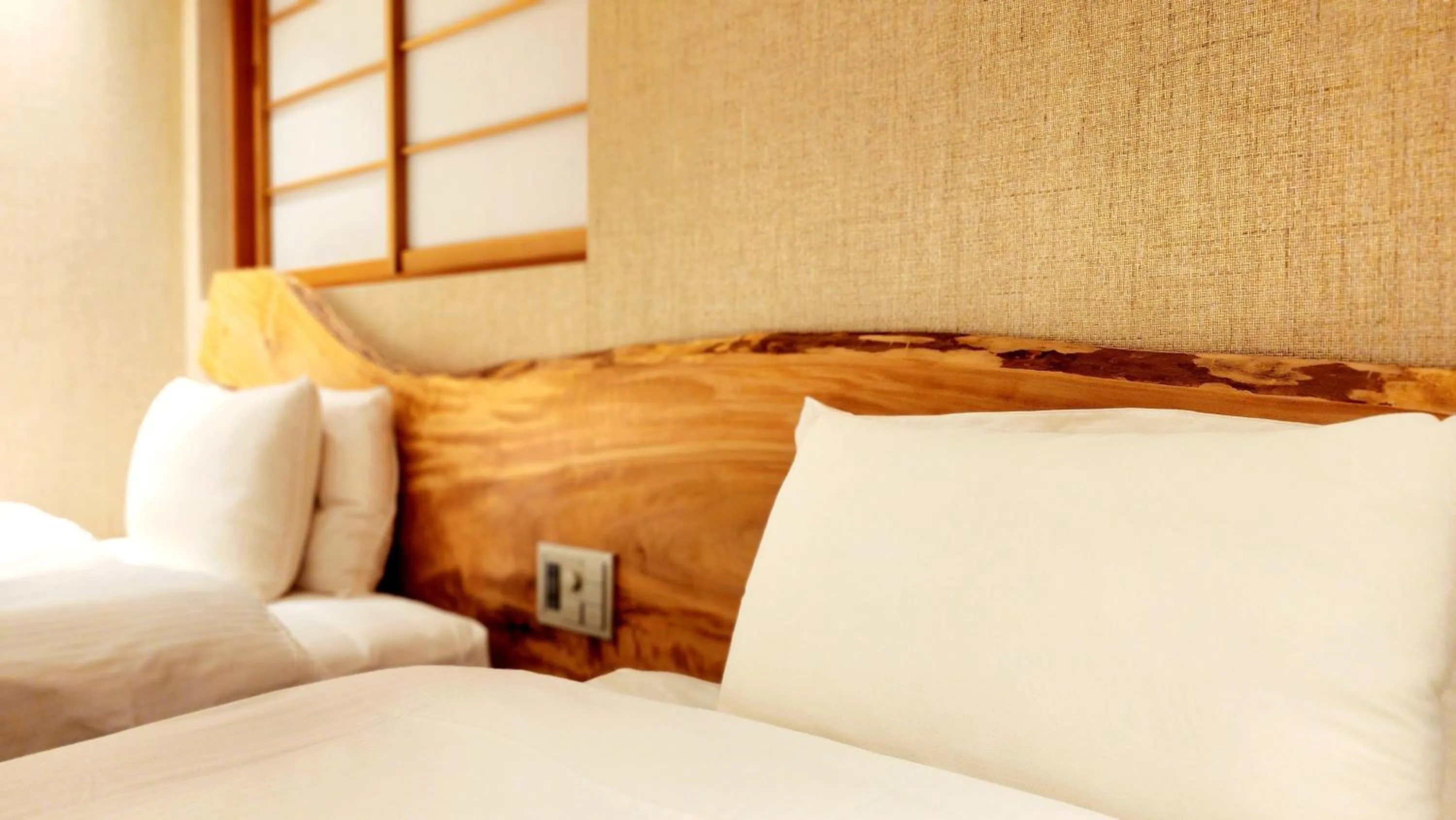 Bed in ひがし茶屋街らしく金沢 Hotel Rashiku kanazawa