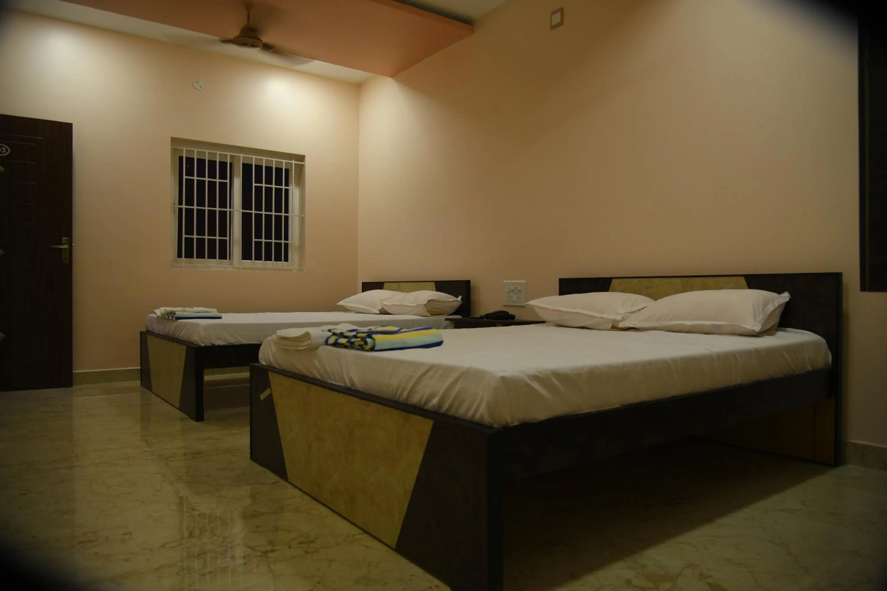 Photo of the whole room, Bed in Sivamurugan residency