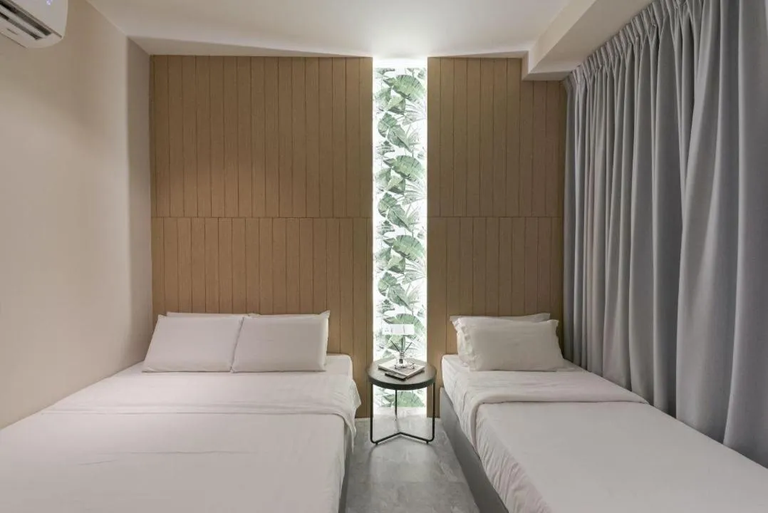 Bed in Harper Boutique Hotel at Sutera Avenue