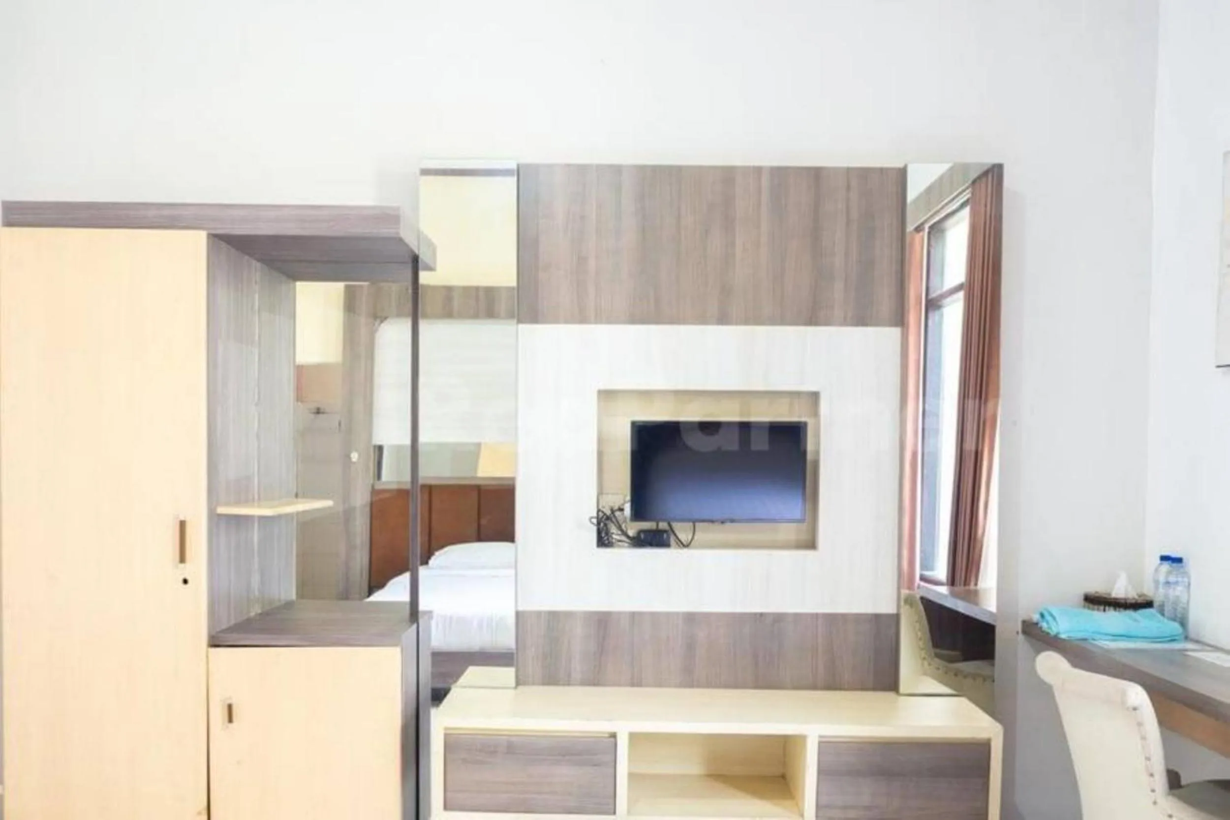 Bed in My Hommy Homestay Mitra RedDoorz