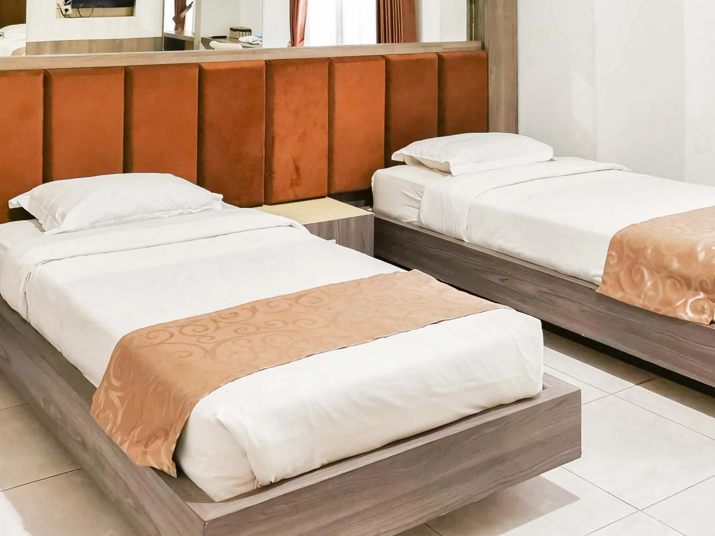 Bed in My Hommy Homestay Mitra RedDoorz