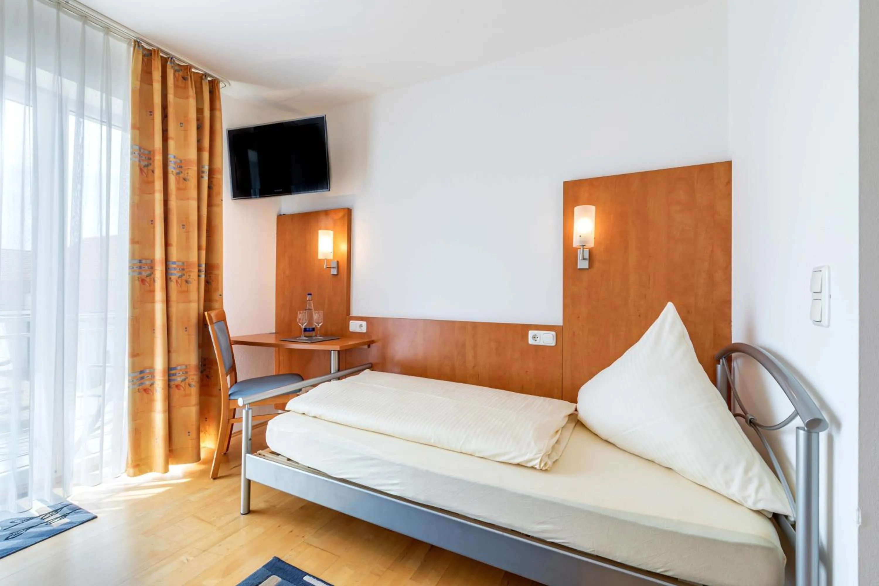 Photo of the whole room, Bed in Gasthaus Hotel Ostermeier