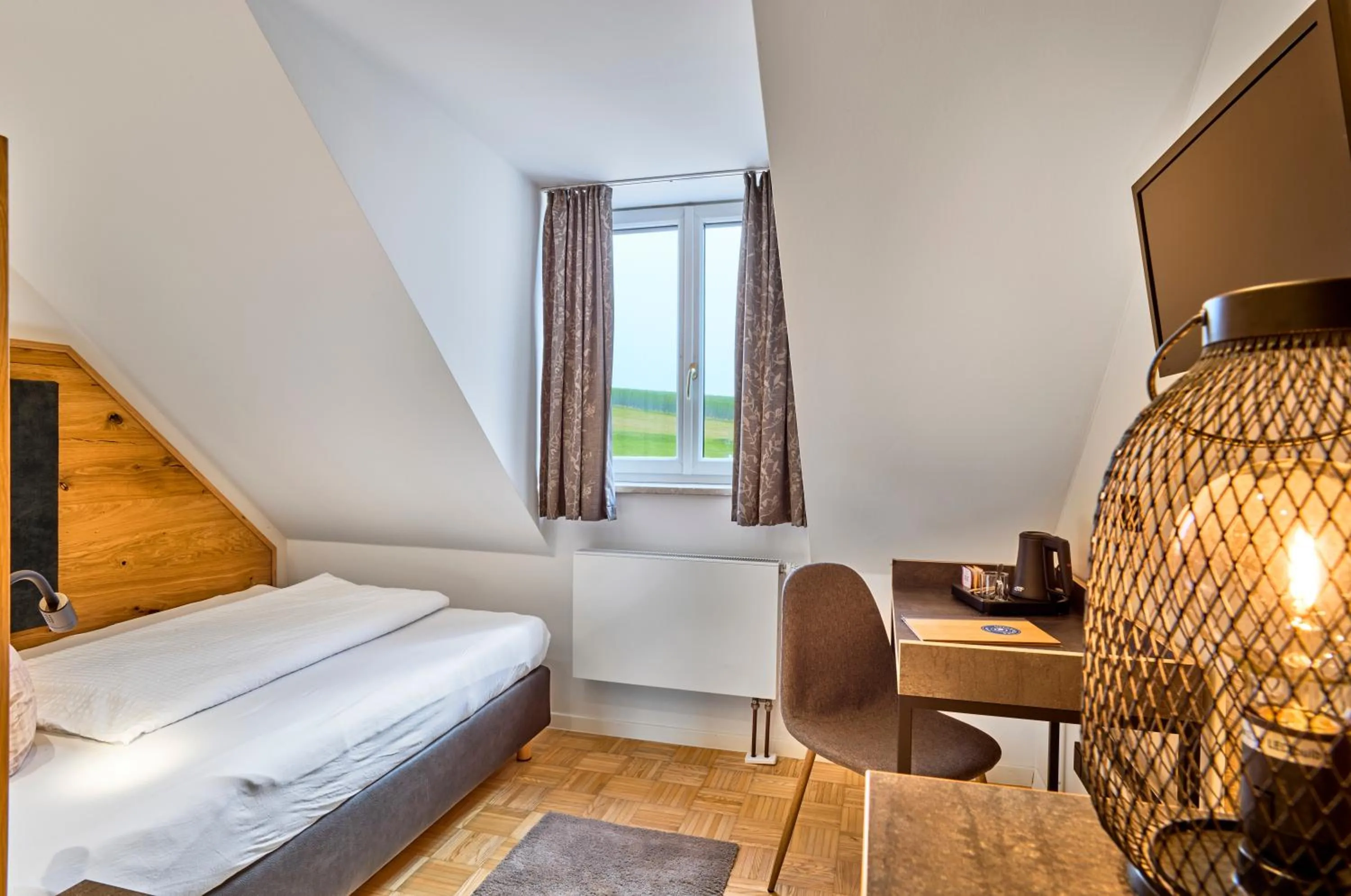 Photo of the whole room, Bed in Gasthaus Hotel Ostermeier