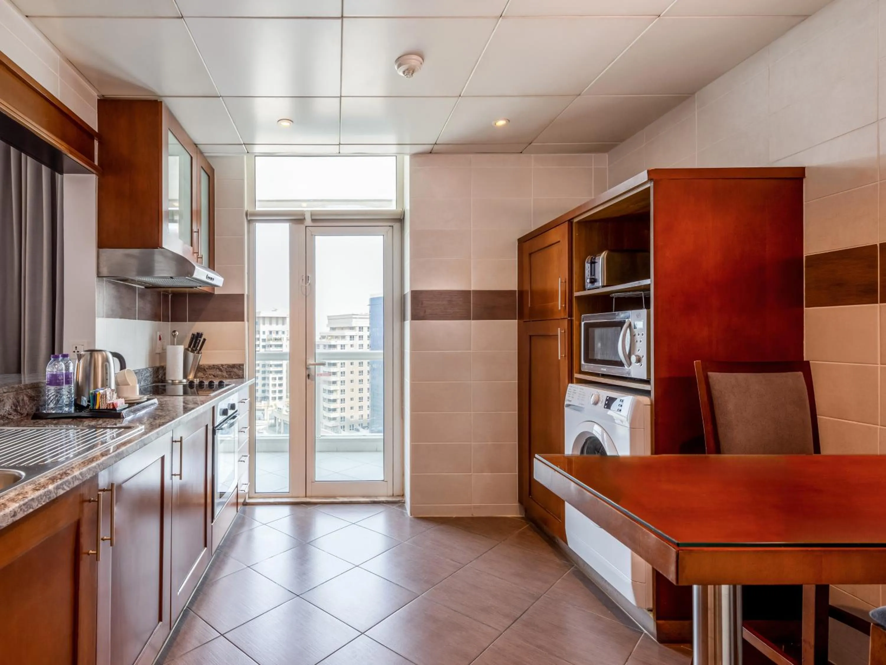 Kitchen or kitchenette in Flora Creek Deluxe Hotel Apartments, Dubai