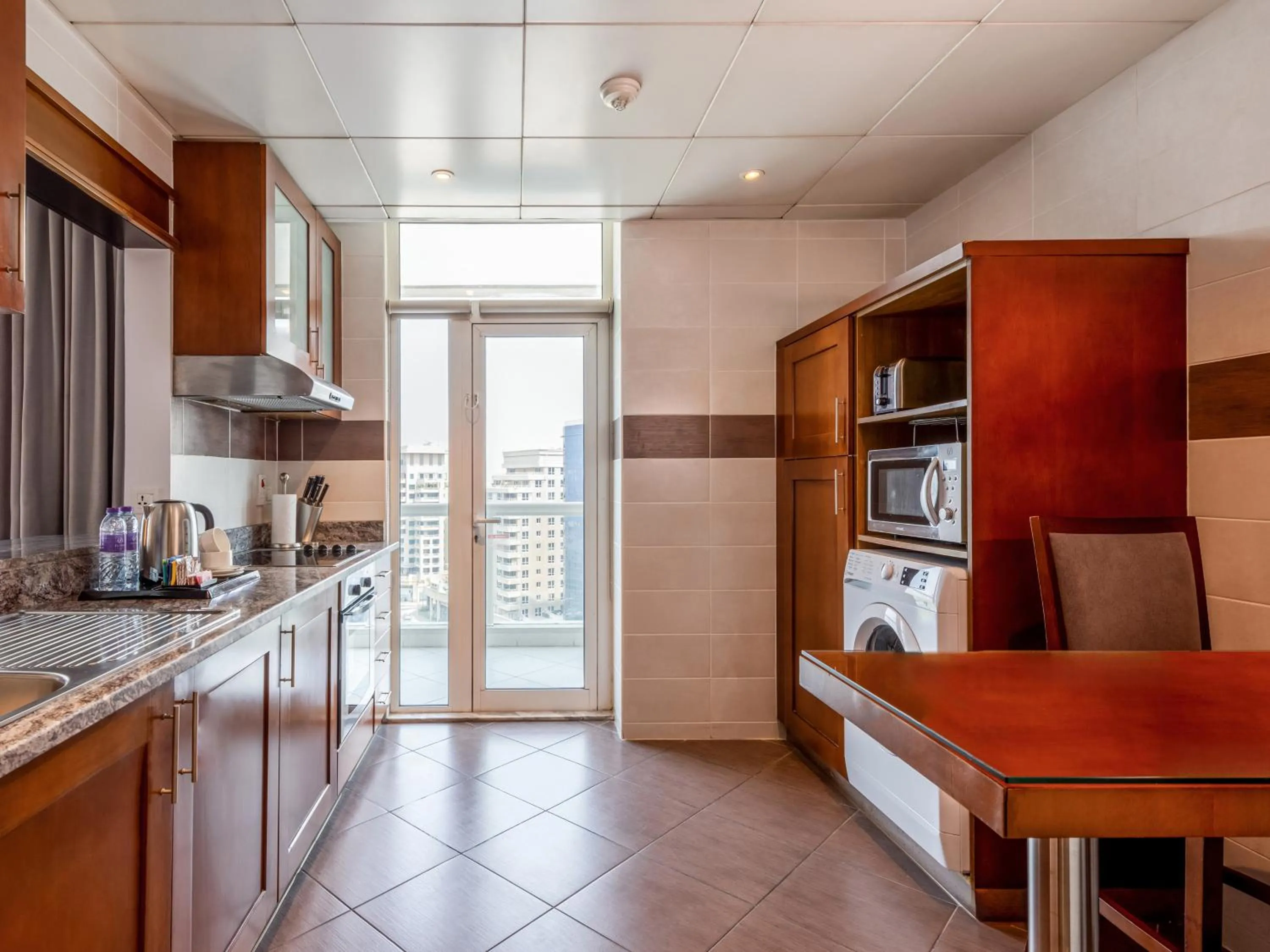 Kitchen or kitchenette in Flora Creek Deluxe Hotel Apartments, Dubai
