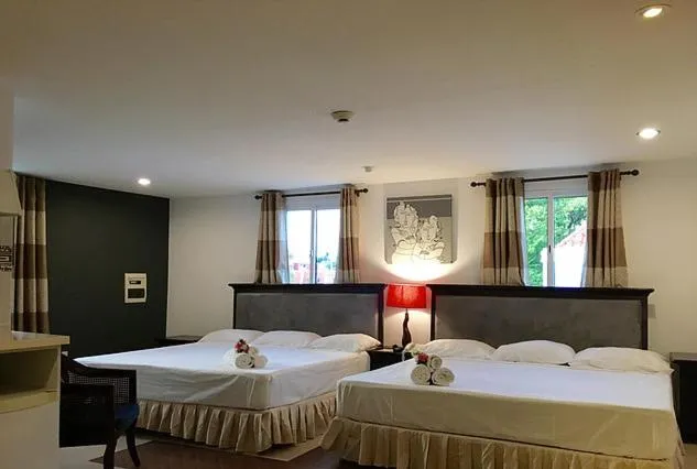 Bed in Curacao Suites Hotel