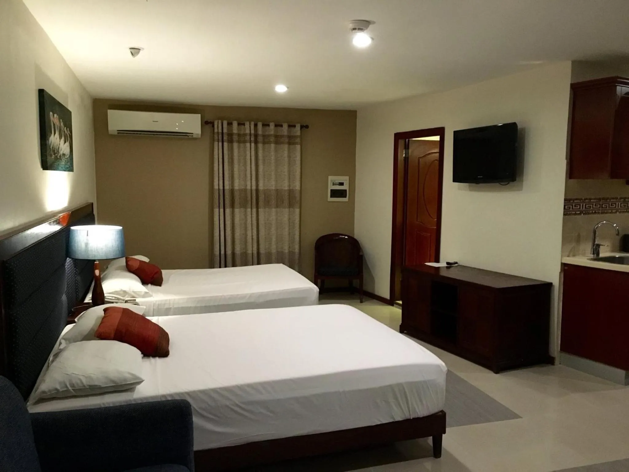 Bed in Curacao Suites Hotel