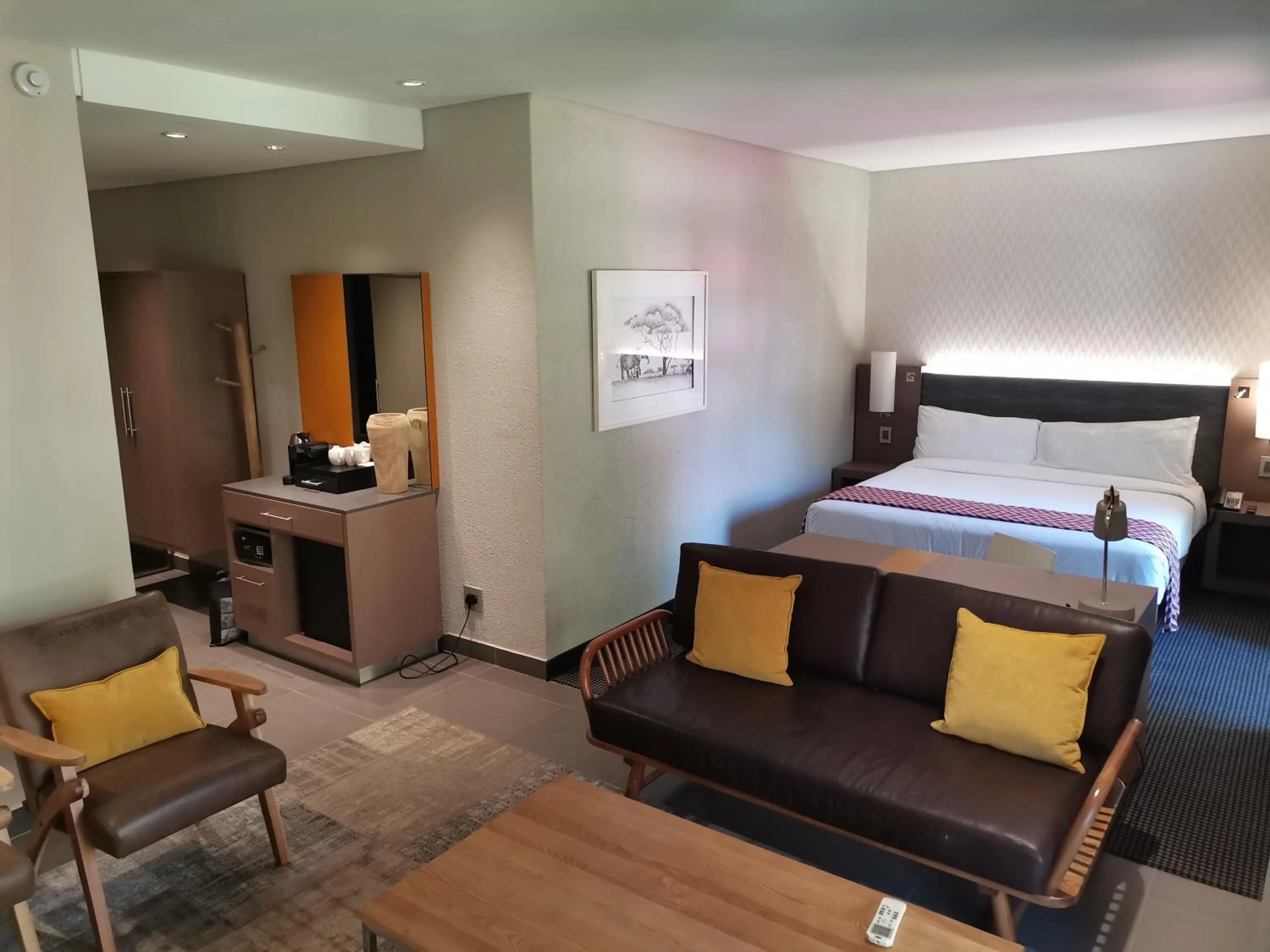 Living room, Bed in Garden Court Polokwane