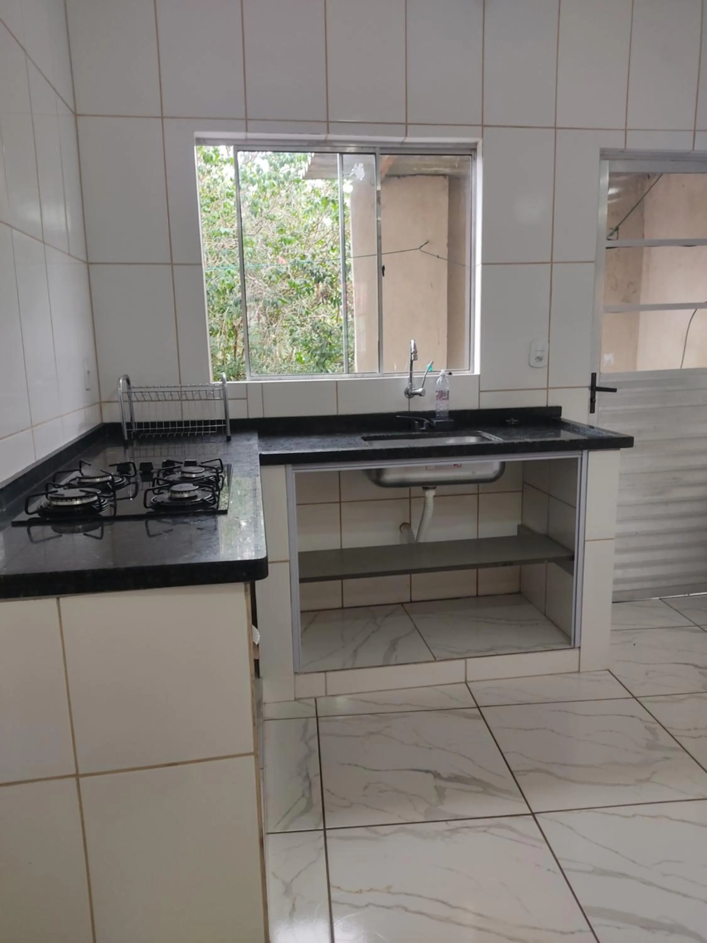 Kitchen or kitchenette in Pousada do Ribeirão