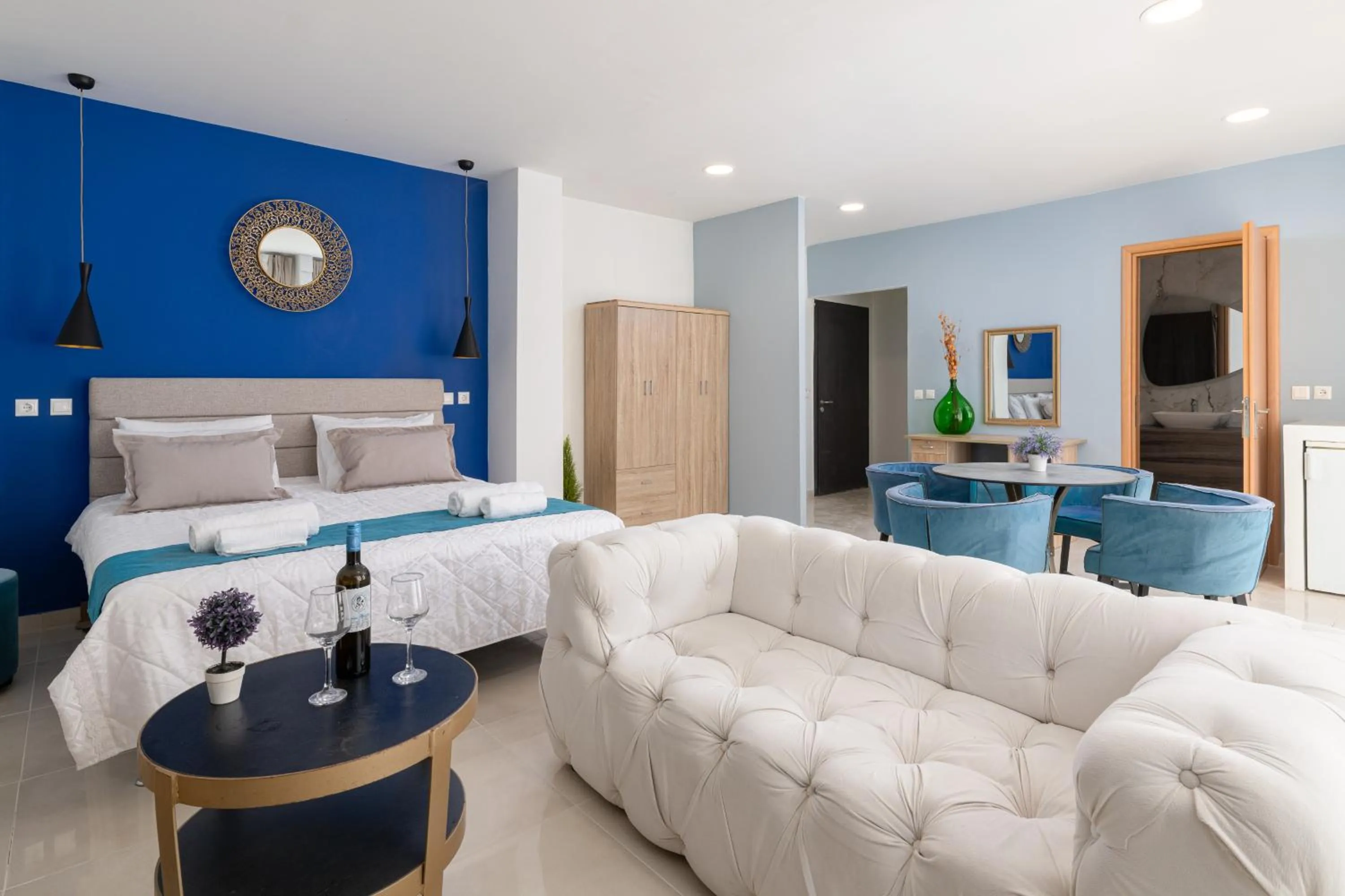 Seating area, Bed in Bamboo Suites Hotel - Adults Only