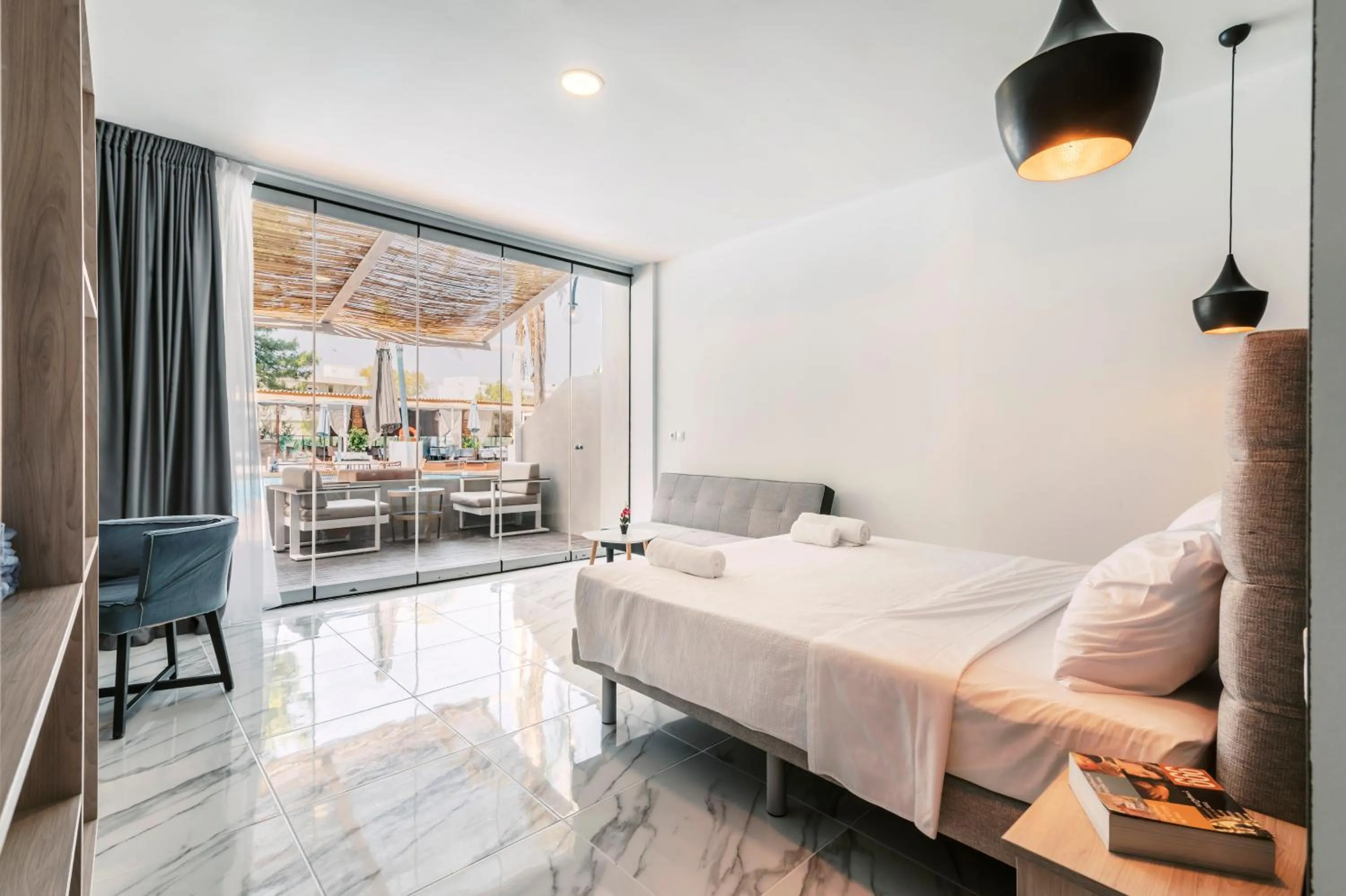 Pool view, Bed in Bamboo Suites Hotel - Adults Only