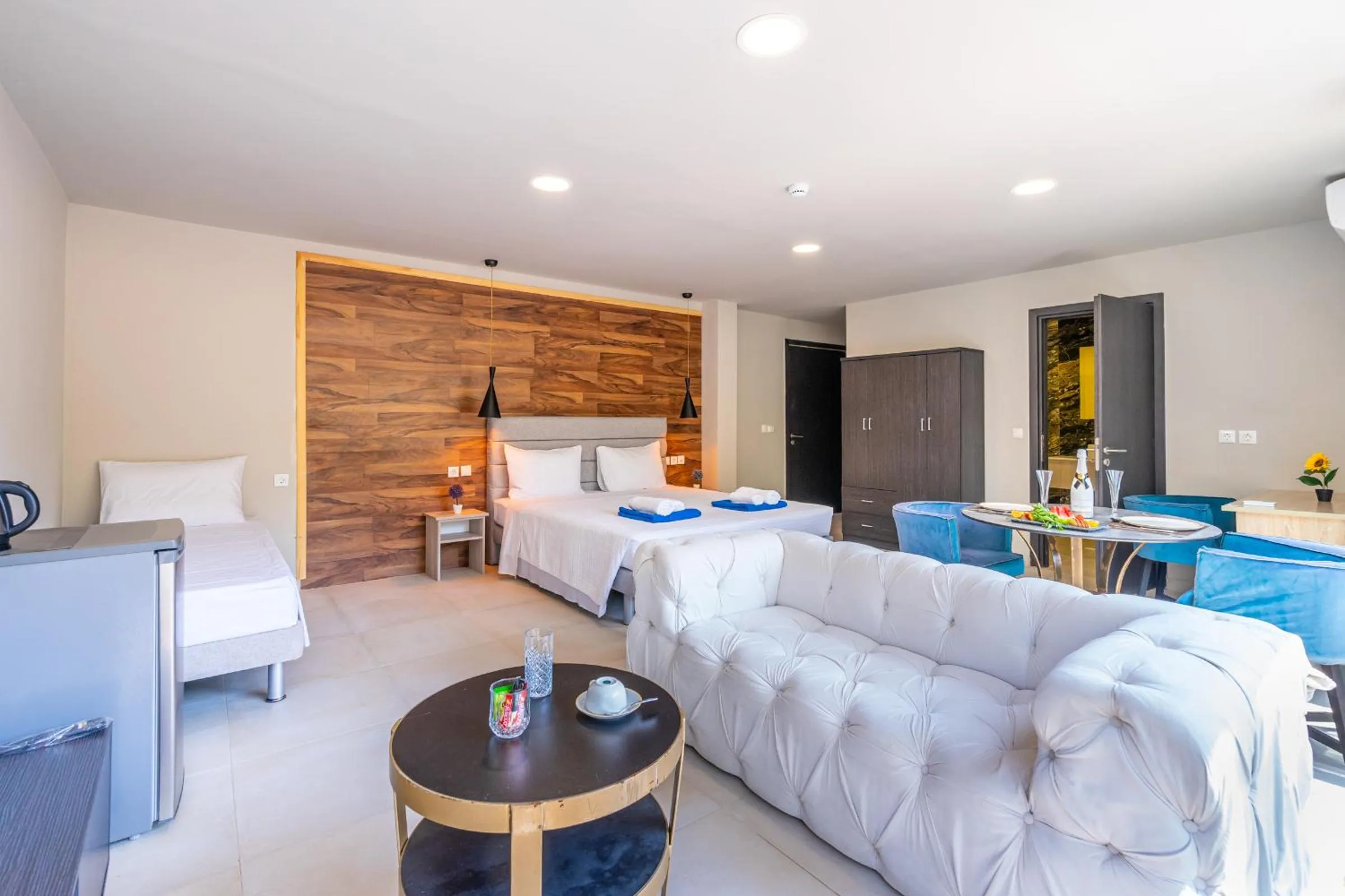 Seating area, Bed in Bamboo Suites Hotel - Adults Only