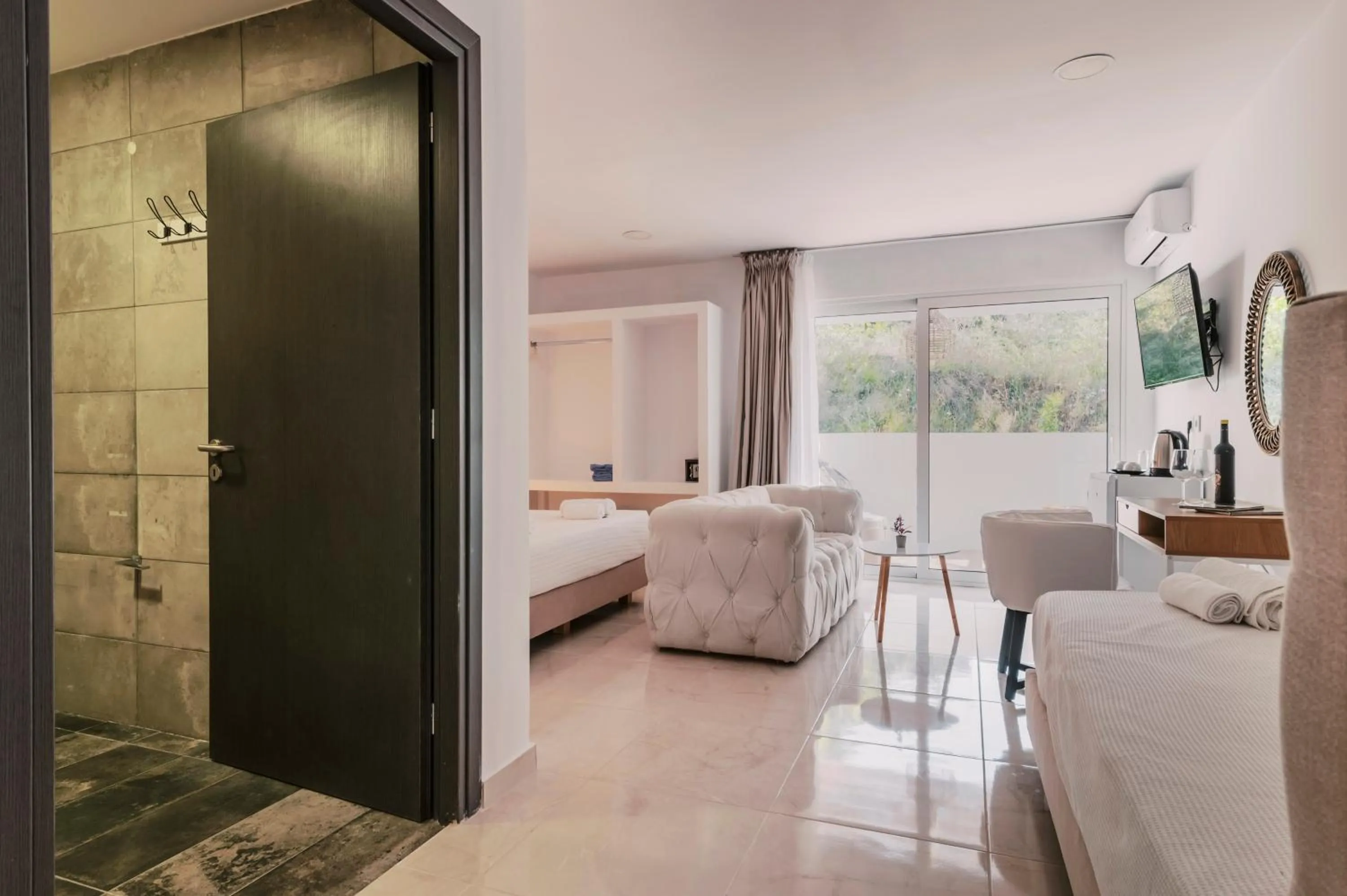 Photo of the whole room, Bed in Bamboo Suites Hotel - Adults Only