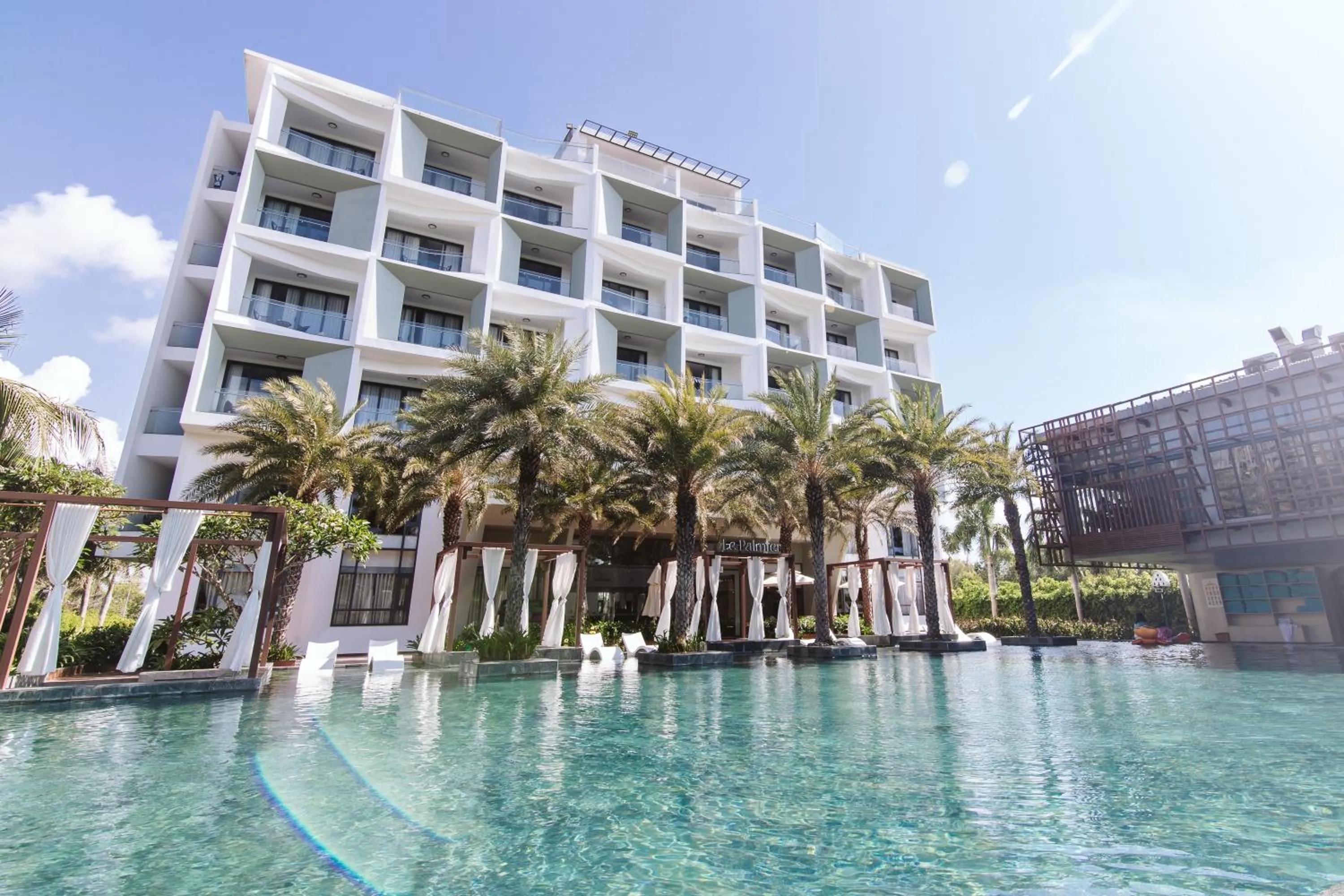 Swimming pool in Le Palmier Ho Tram Resort - Beachfront with Private Beach