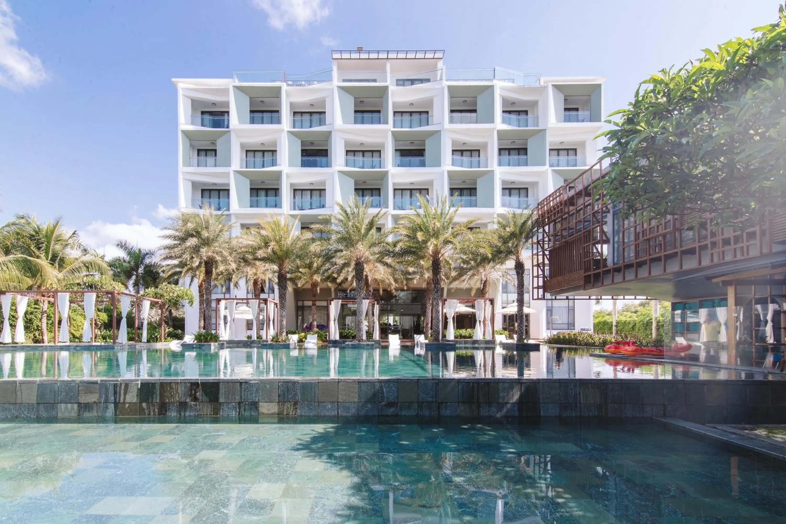 Swimming pool in Le Palmier Ho Tram Resort - Beachfront with Private Beach