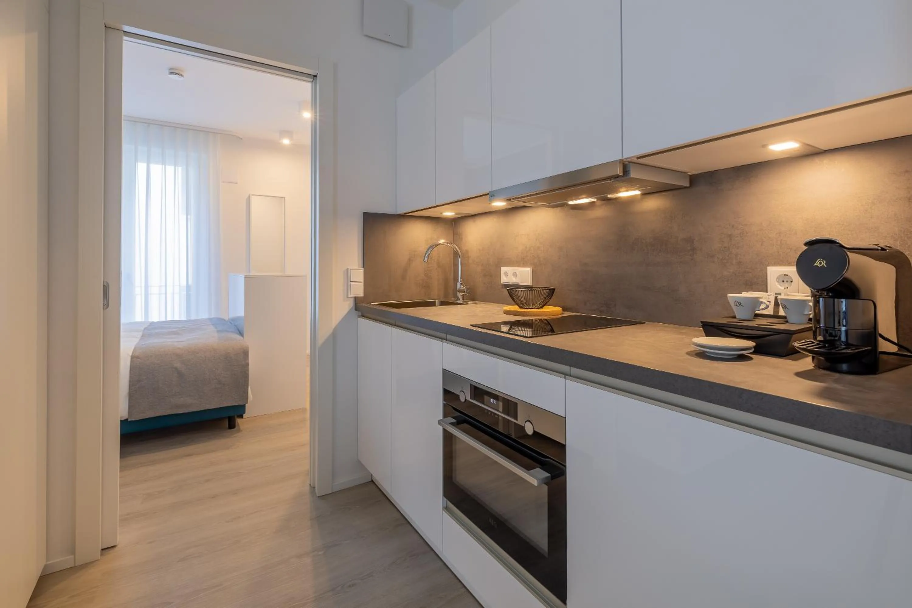 Kitchen or kitchenette, Bed in ATLANTIC Grand Hotel Travemünde