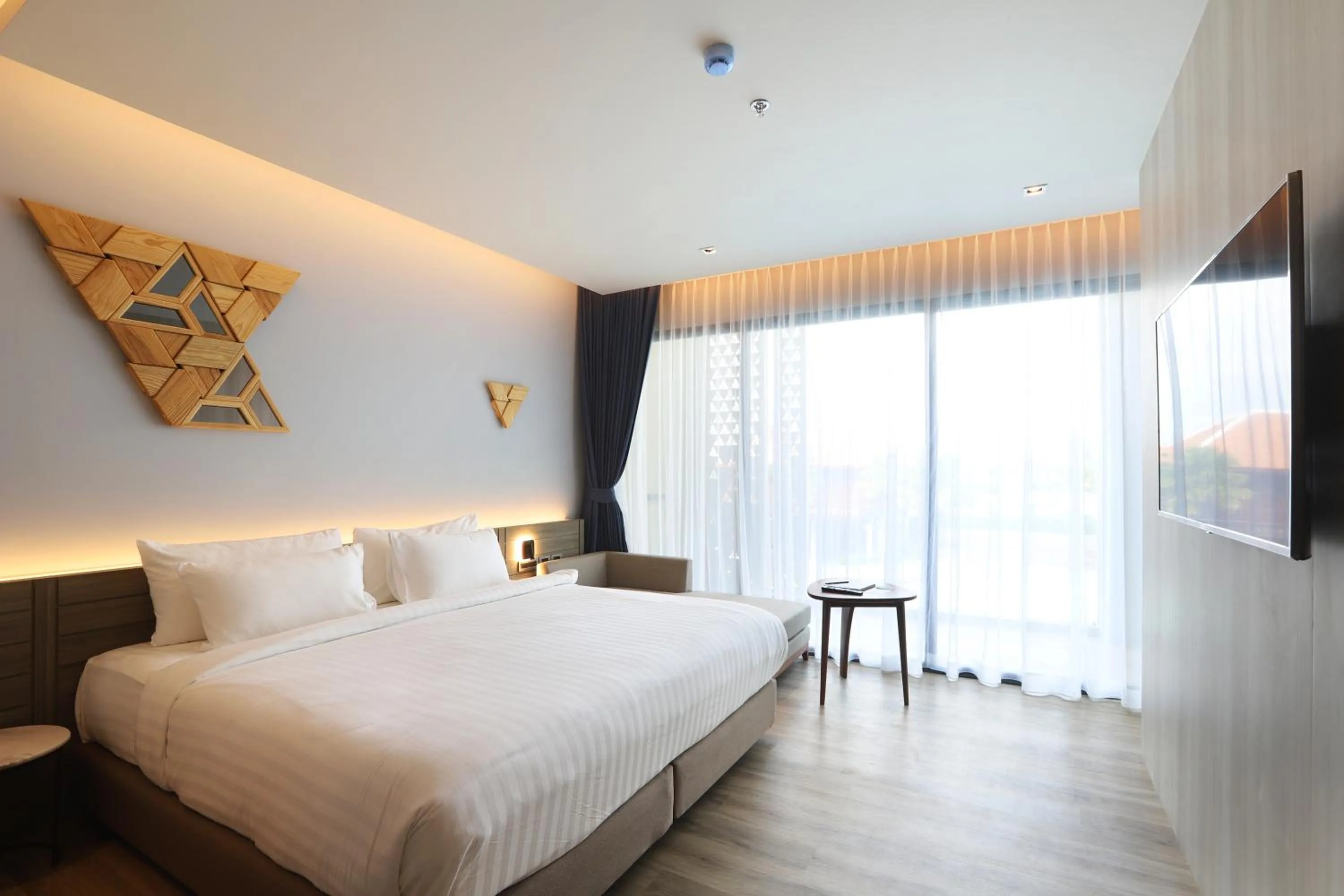 Bed in The Signature Hotel Airport