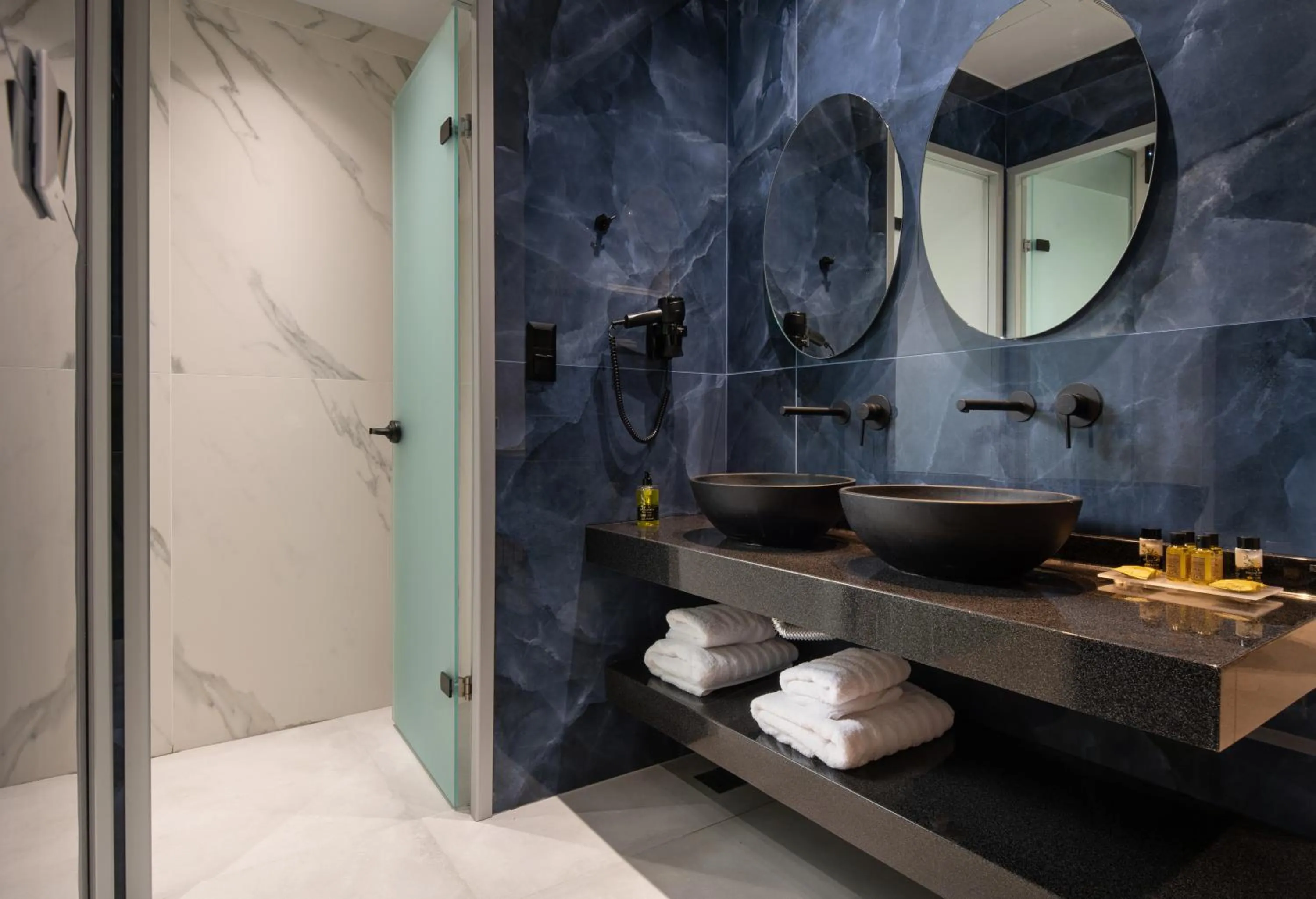 Shower in Lagomandra Luxury Suites with Private Pools