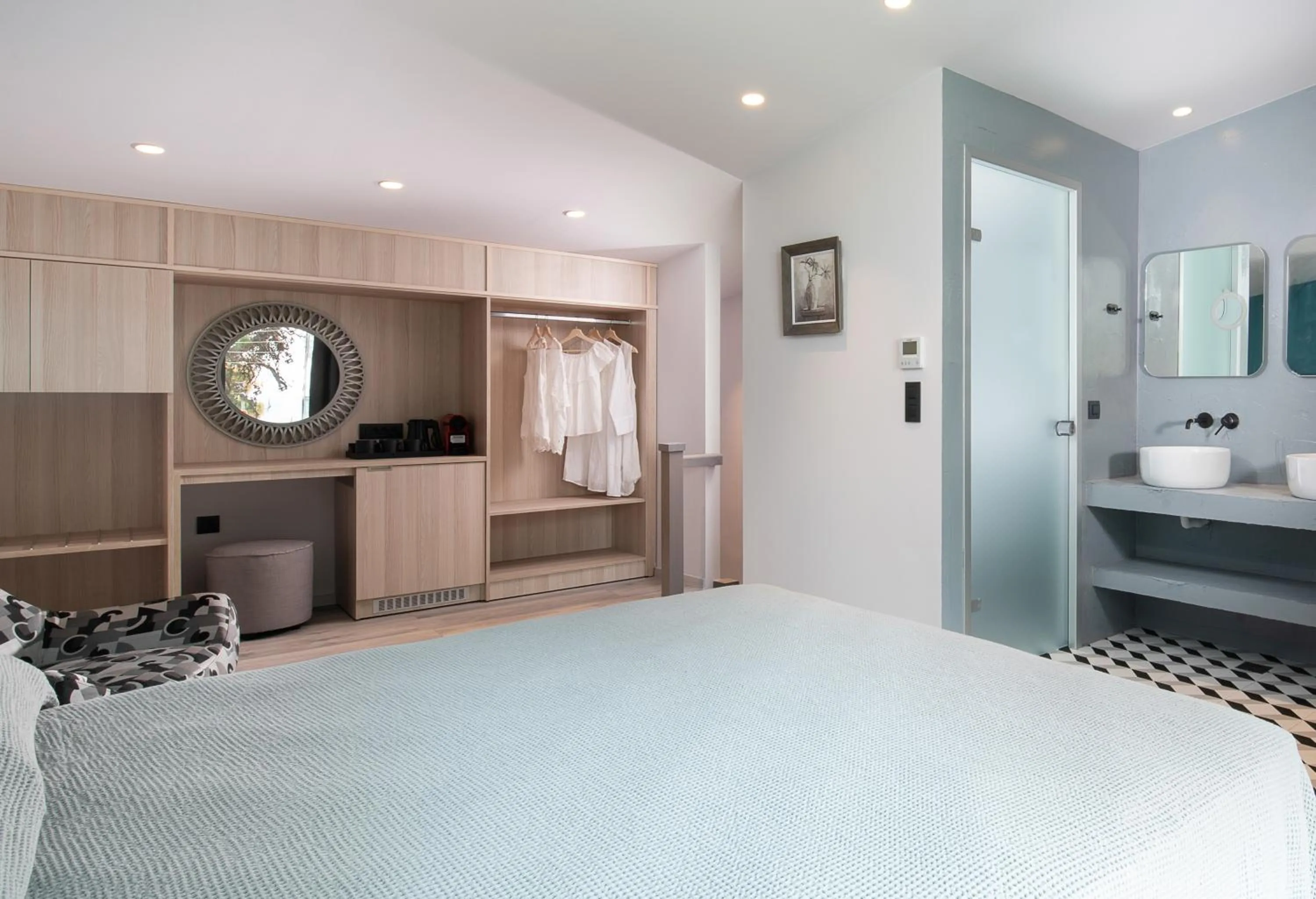 Bed in Lagomandra Luxury Suites with Private Pools