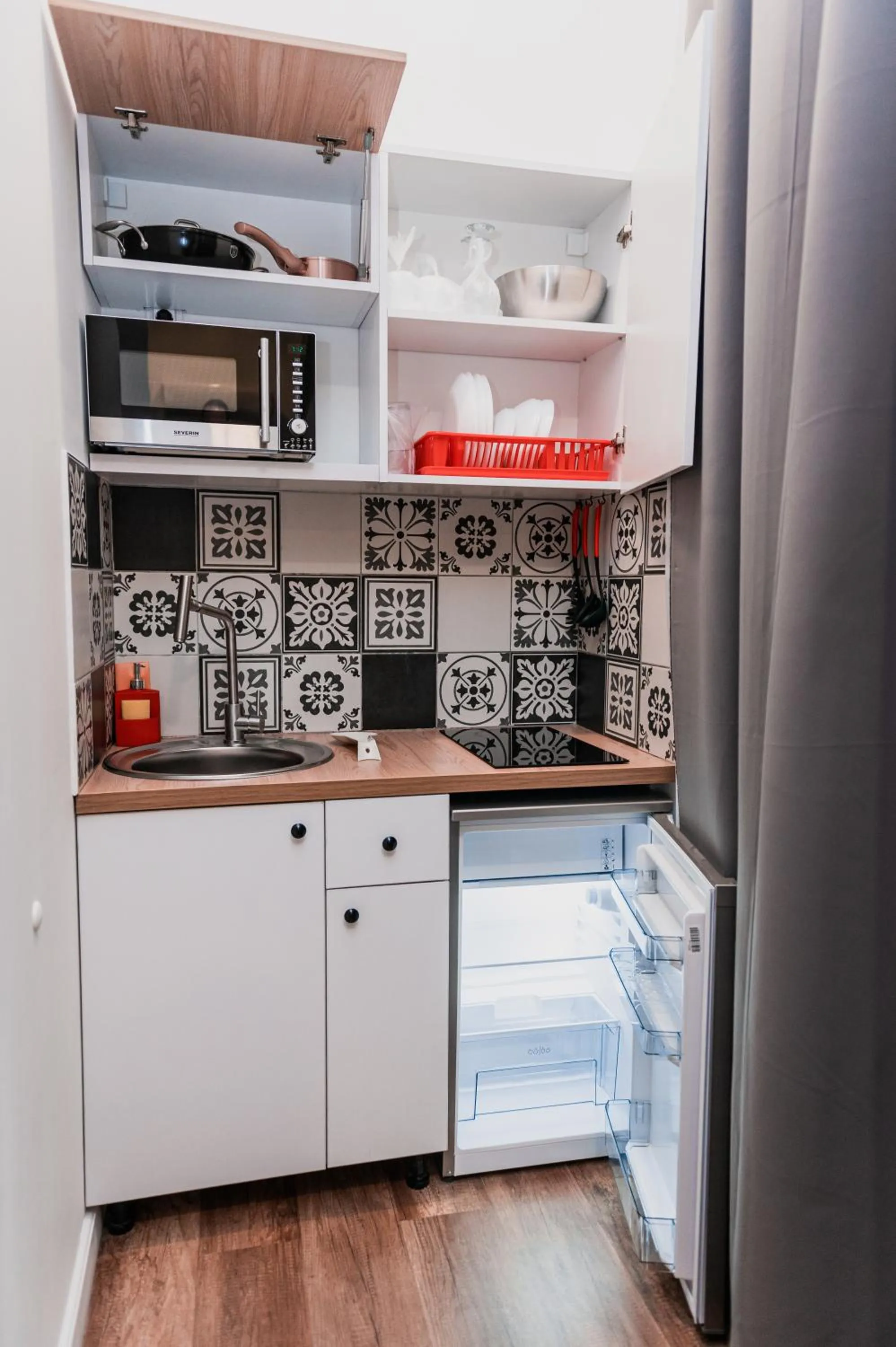 Kitchen or kitchenette in Puzzle Apartaments&Studios