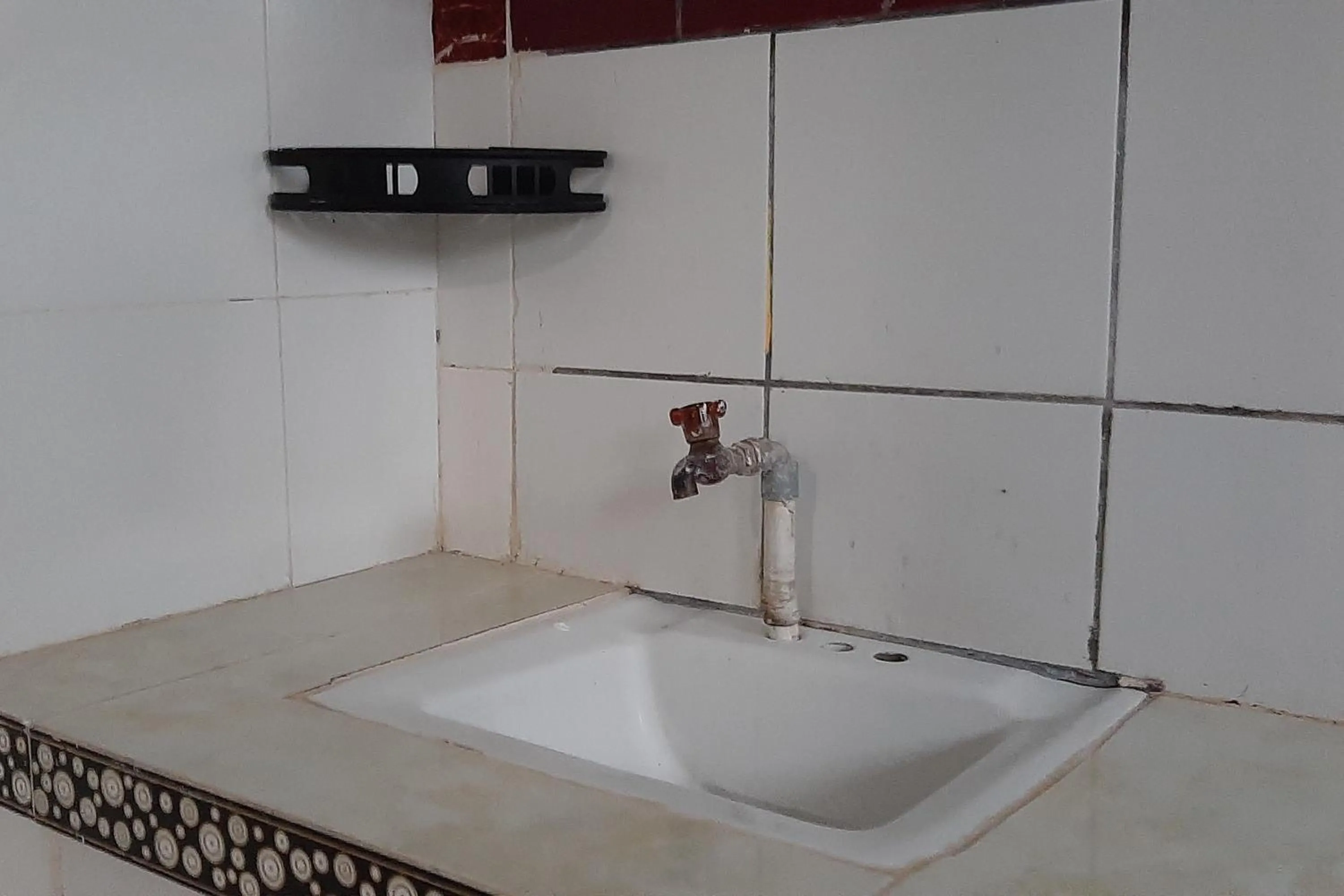 Kitchen or kitchenette in RedDoorz At Hotel Pakem Sari Kaliurang