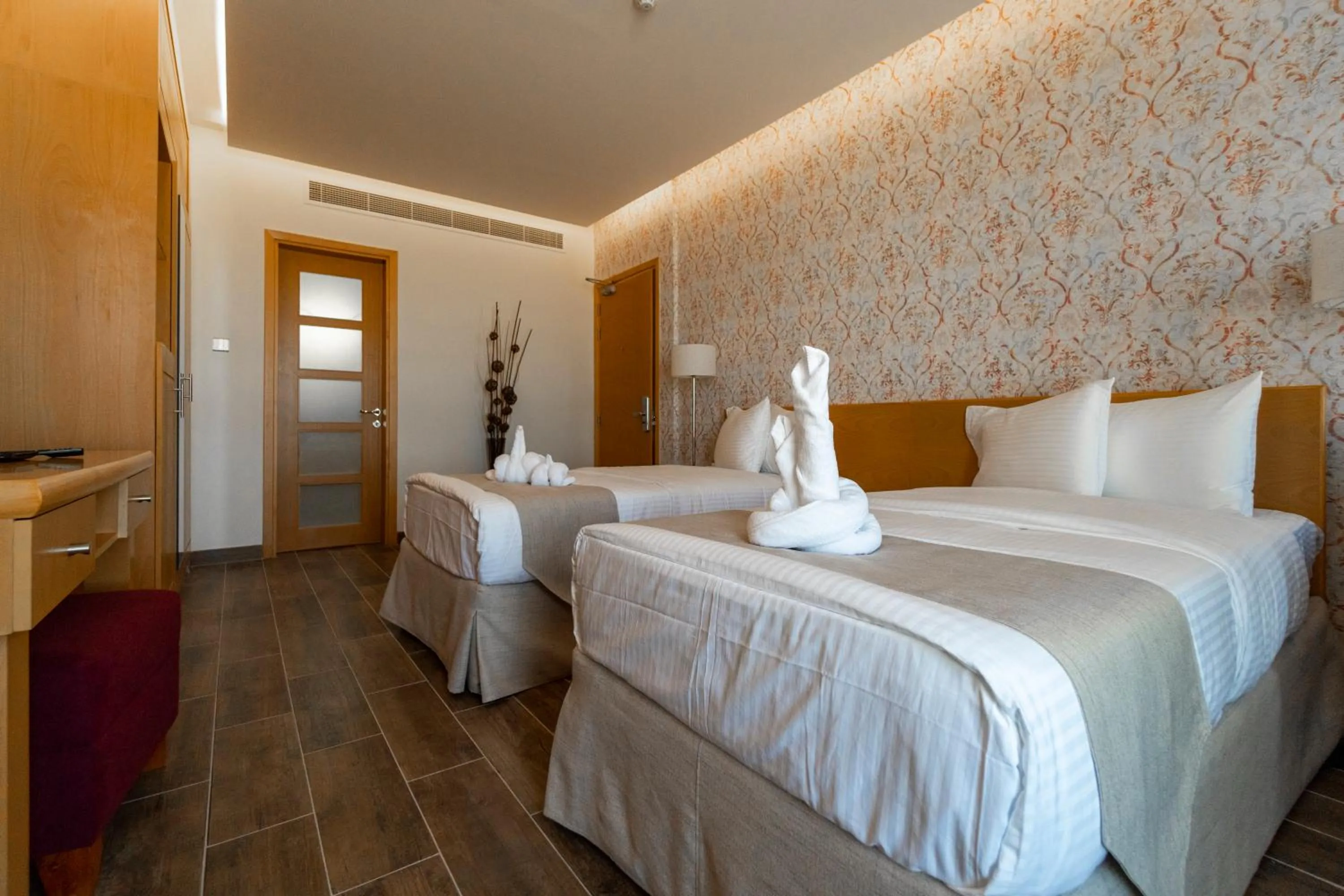 Bed in Sama Muscat Hotel